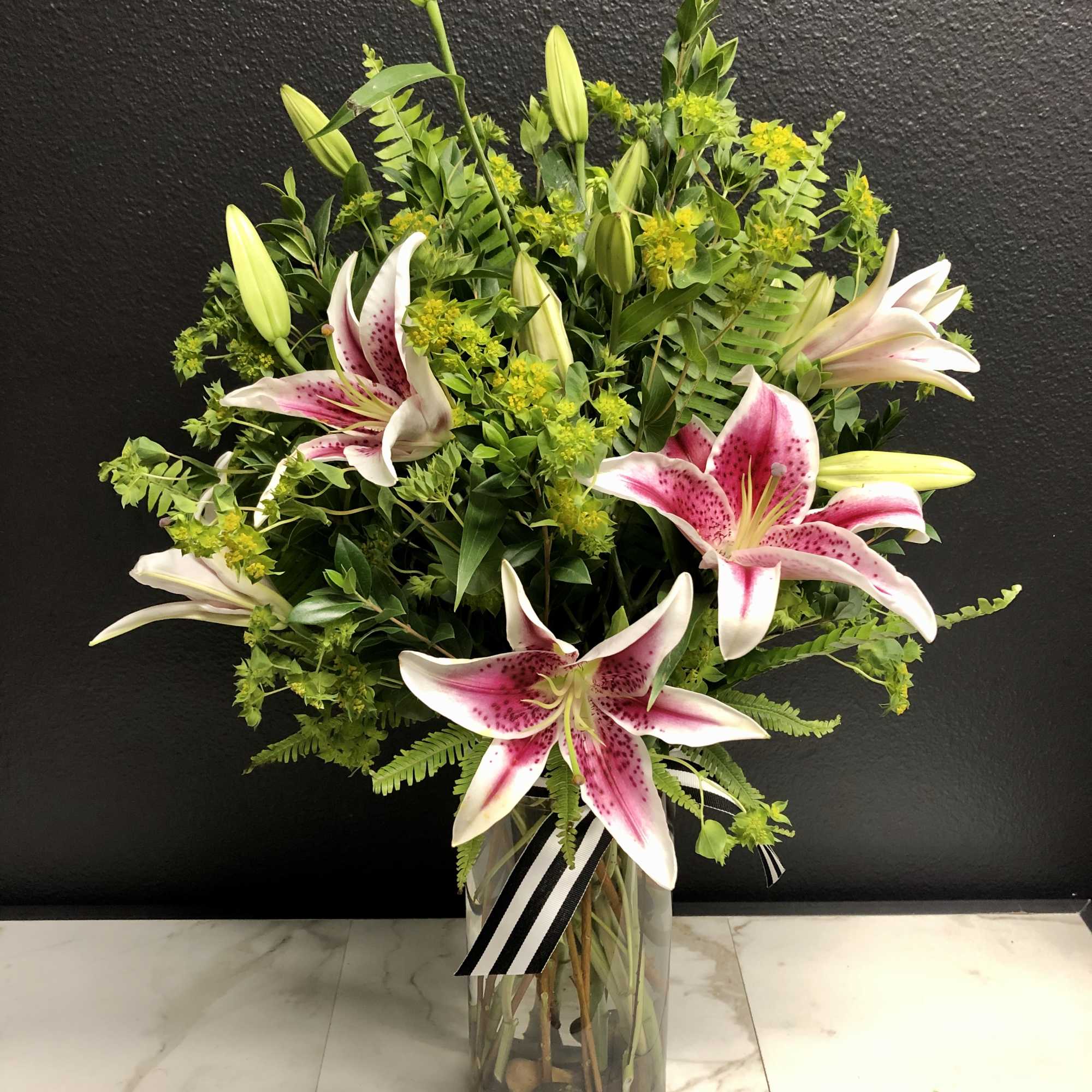 A fragrant arrangement of our most beautiful Pink Oriental Lilies accented with