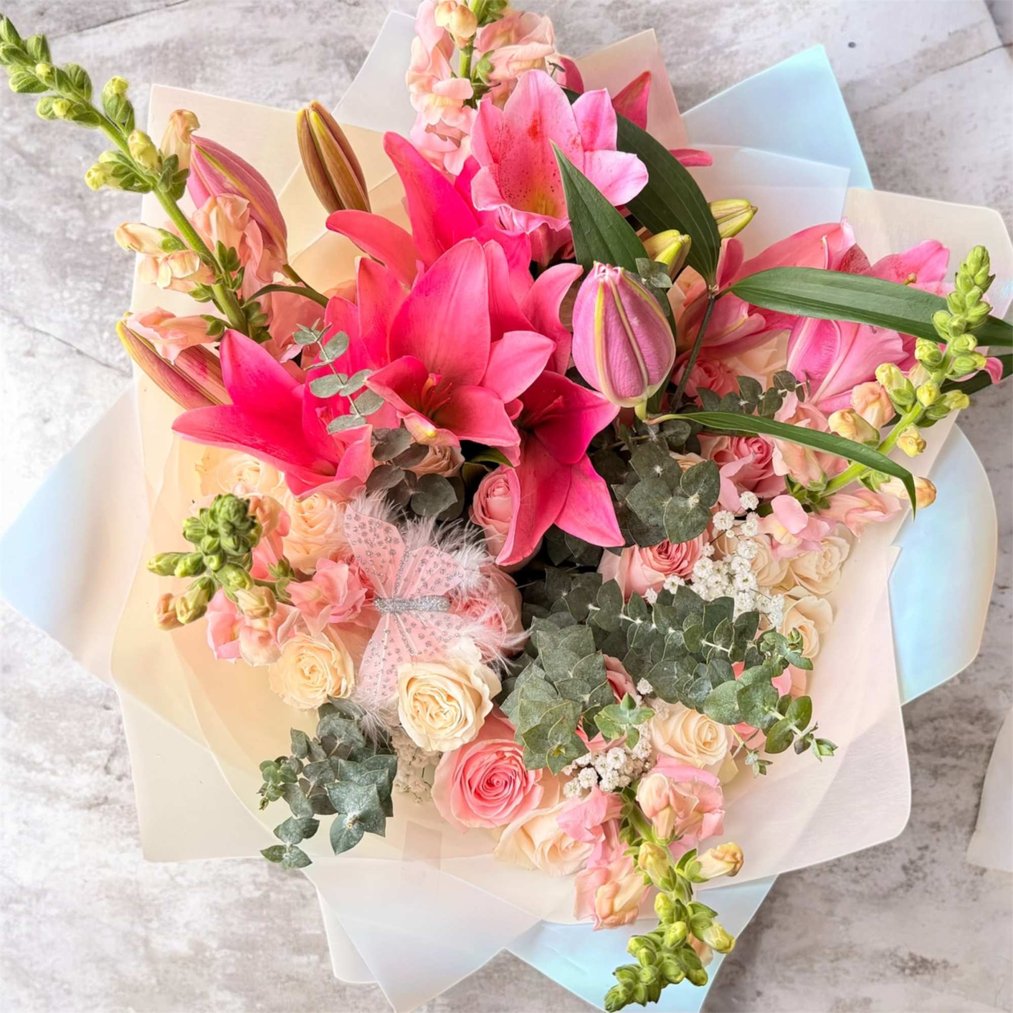 A refined floral boutique crafting elegant arrangements in soft blush tones and