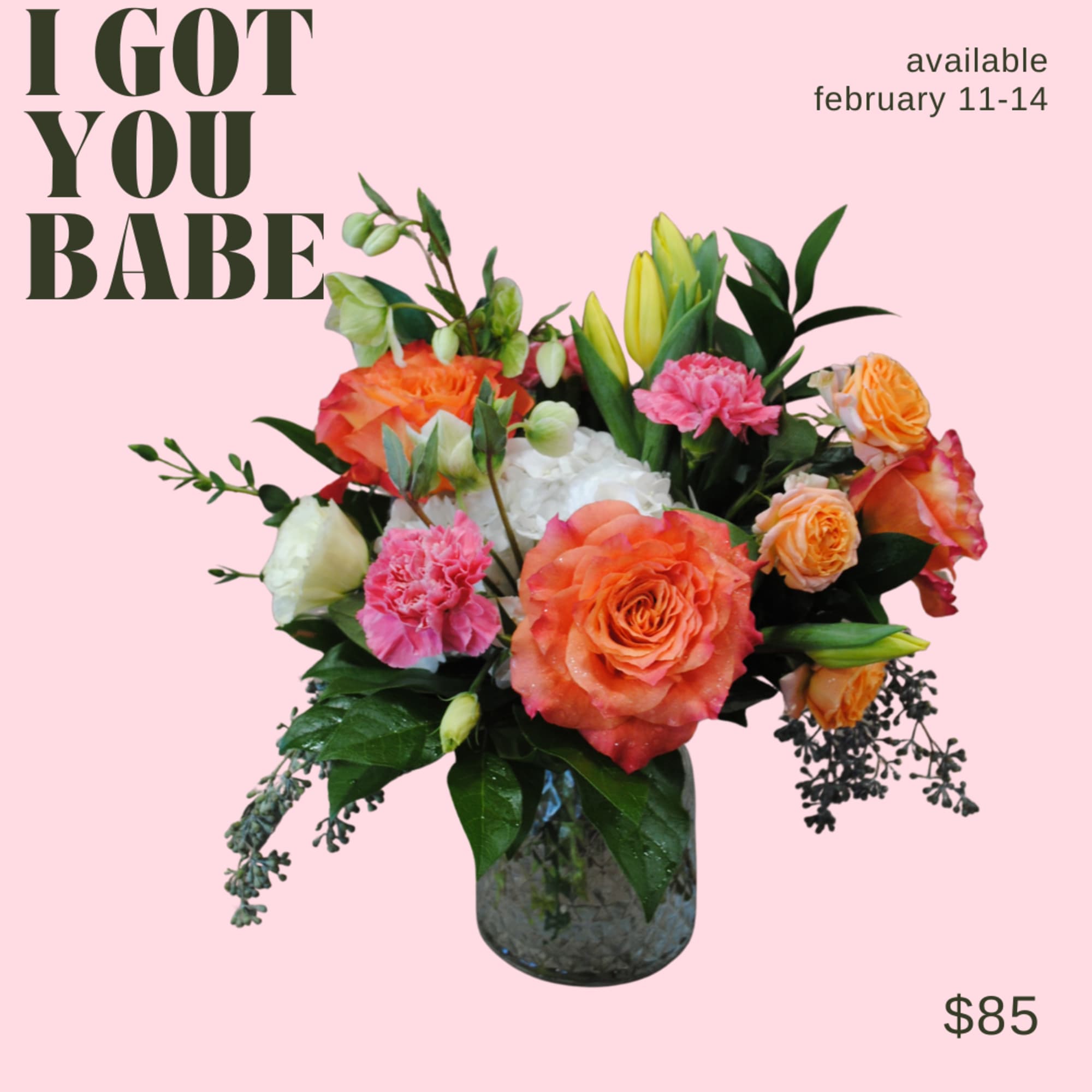 An arrangement in primarily orange tones, in a glass vase! 

Deluxe and