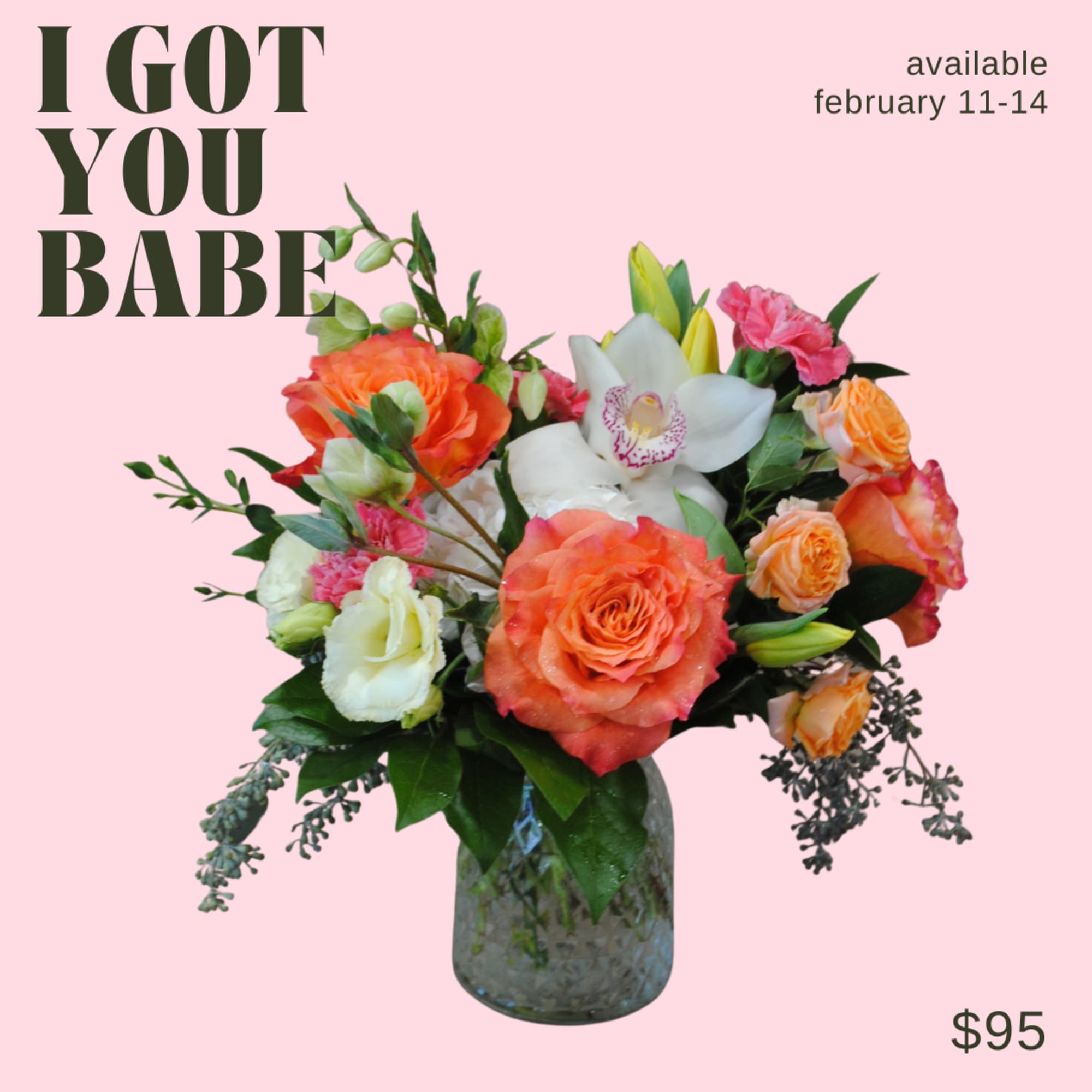 An arrangement in primarily orange tones, in a glass vase! 

Deluxe and