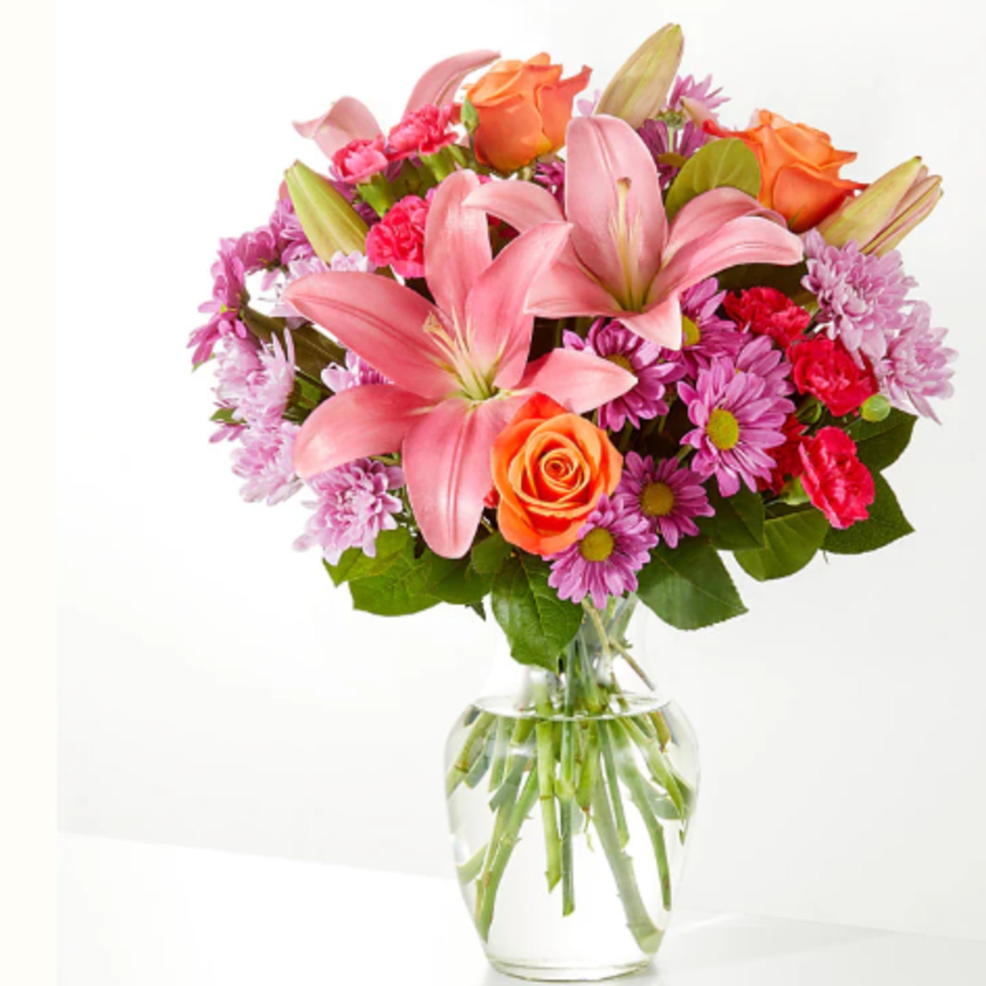 A carefully selected blend of roses, daisies, and lilies make for a