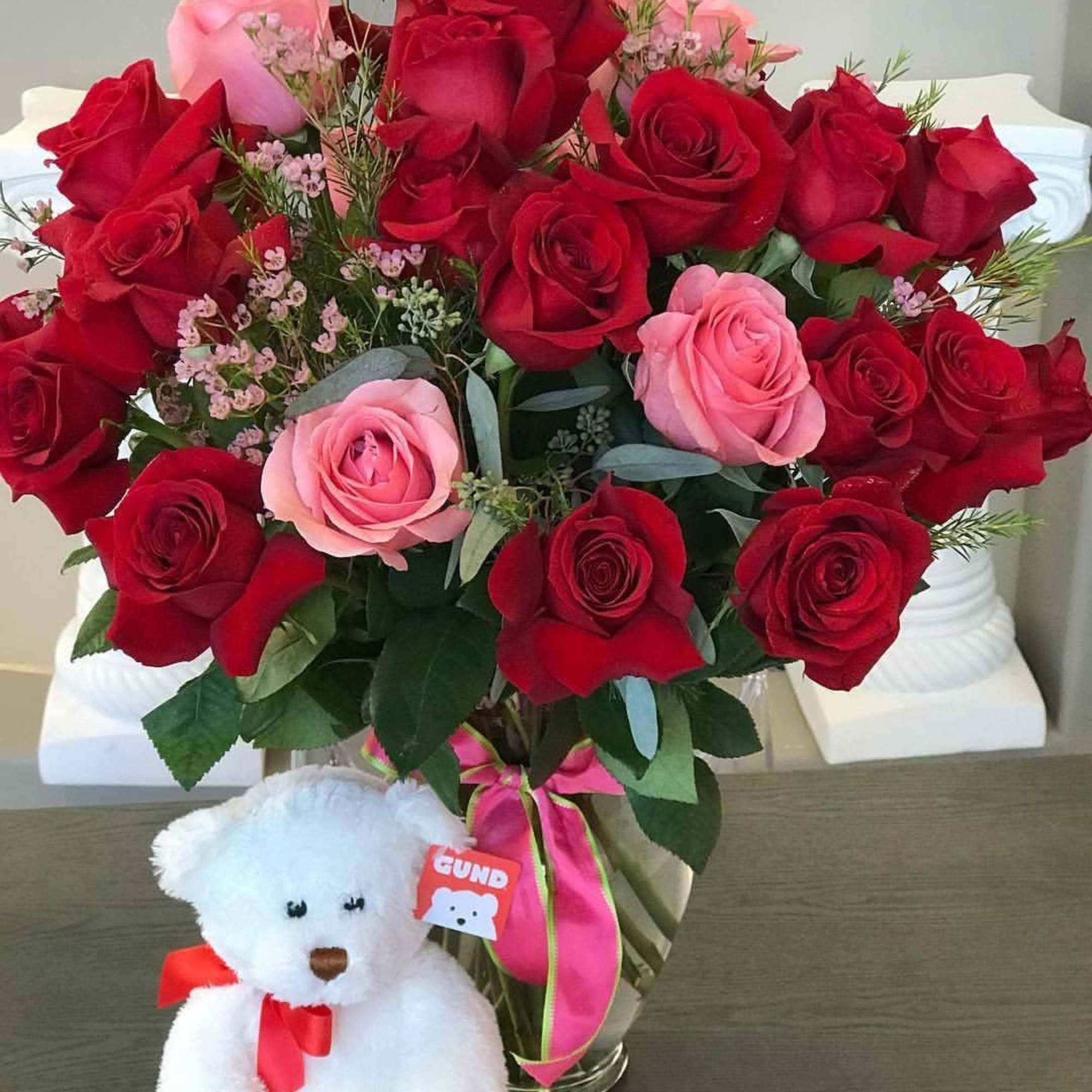 Long Stemmed Dozen Roses with lush assorted greenery in a vase. 
Specify