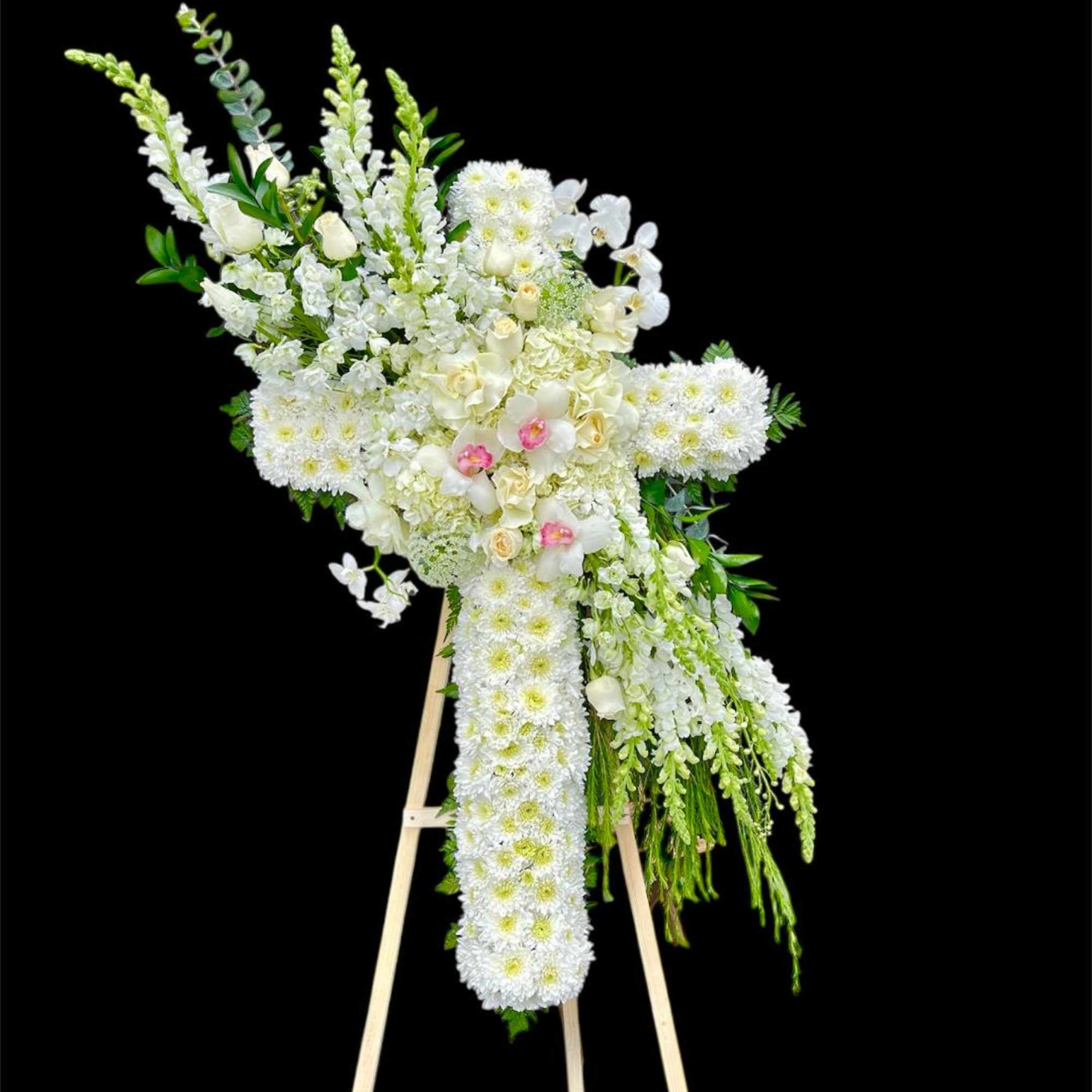 Funeral cross standing.
Many cultures and religions use symbols during funeral services to