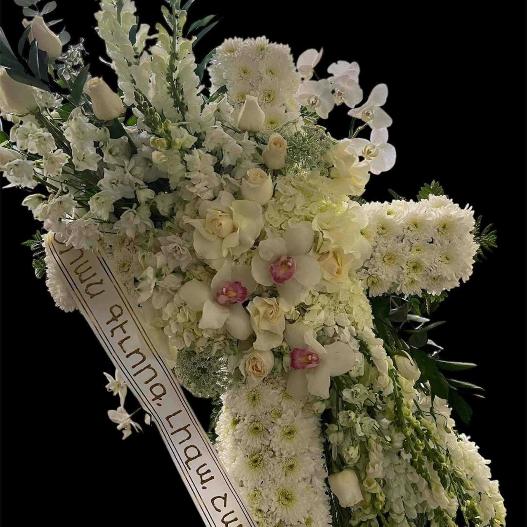 Funeral cross standing.
Many cultures and religions use symbols during funeral services to