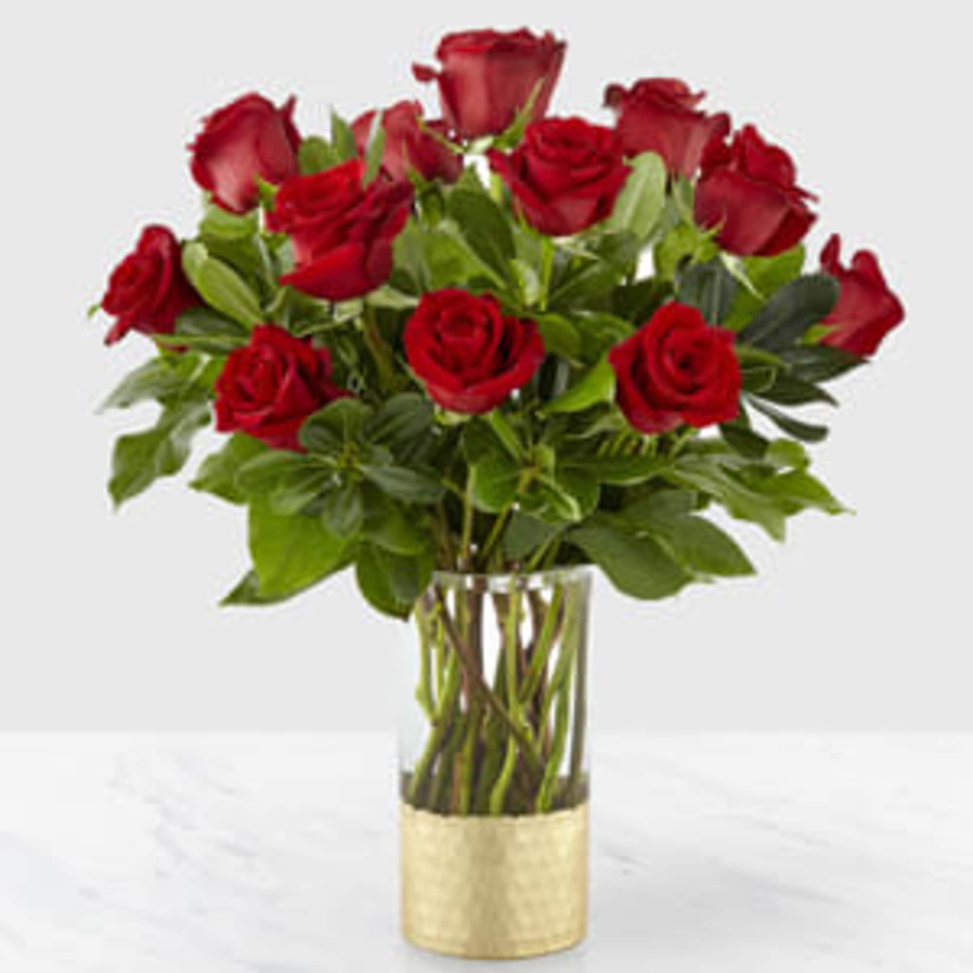 An elegant collection of deep red roses is perfect for saying, "our