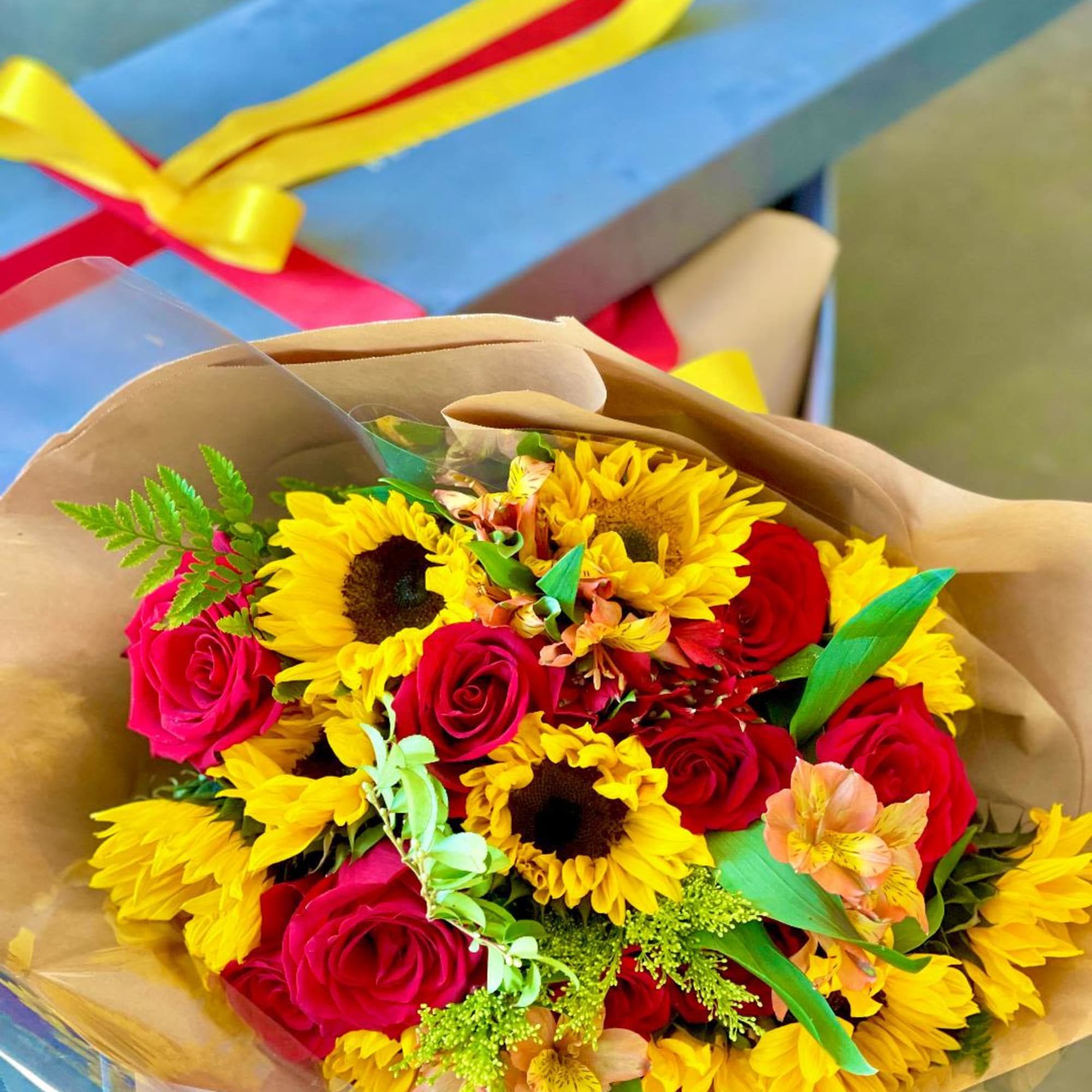 Roses &amp; Sunflowers in a luxury box, designer's choice arrangement. Please call