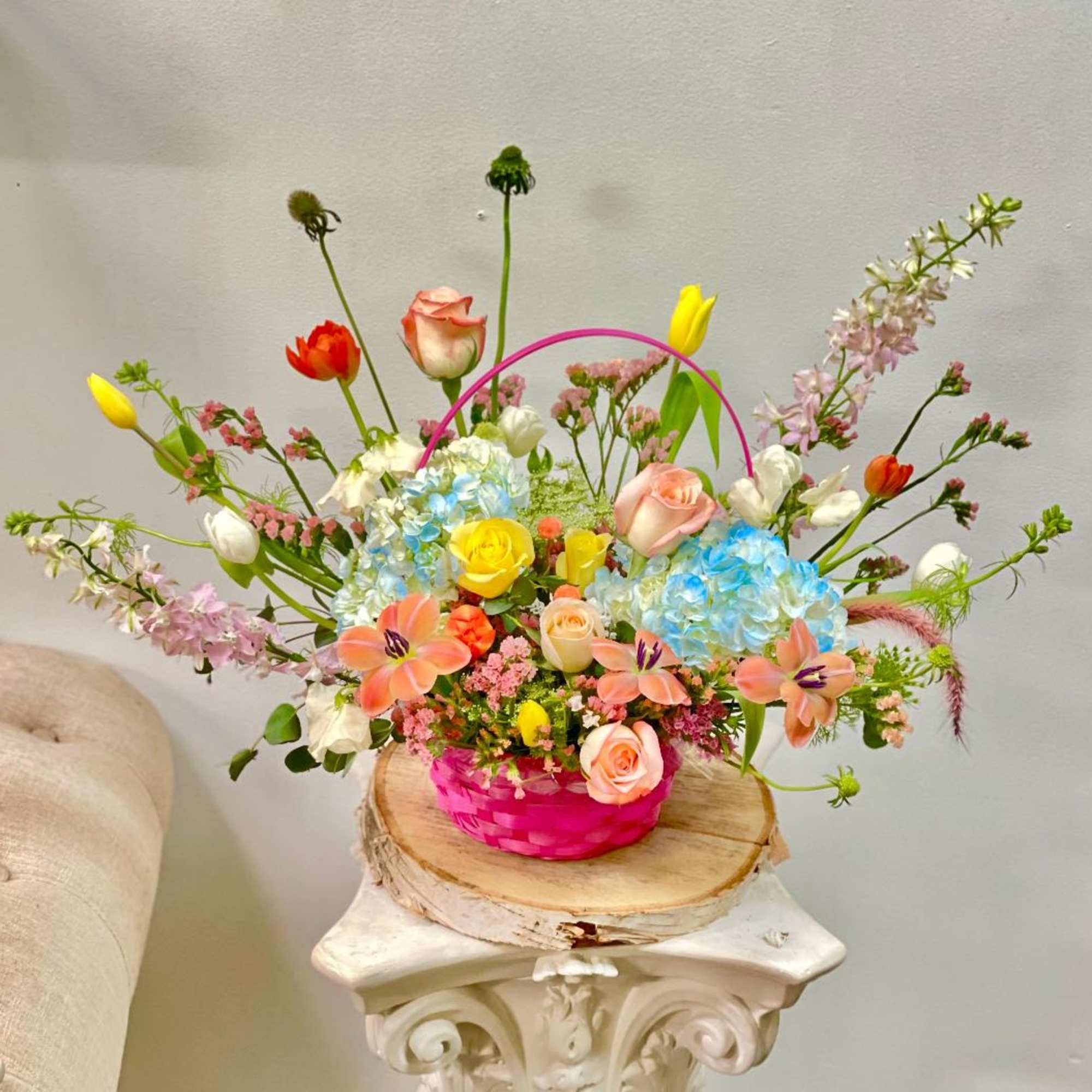 Theme Colors: Shades of peach and yellow in a basket 

Featured Blooms: