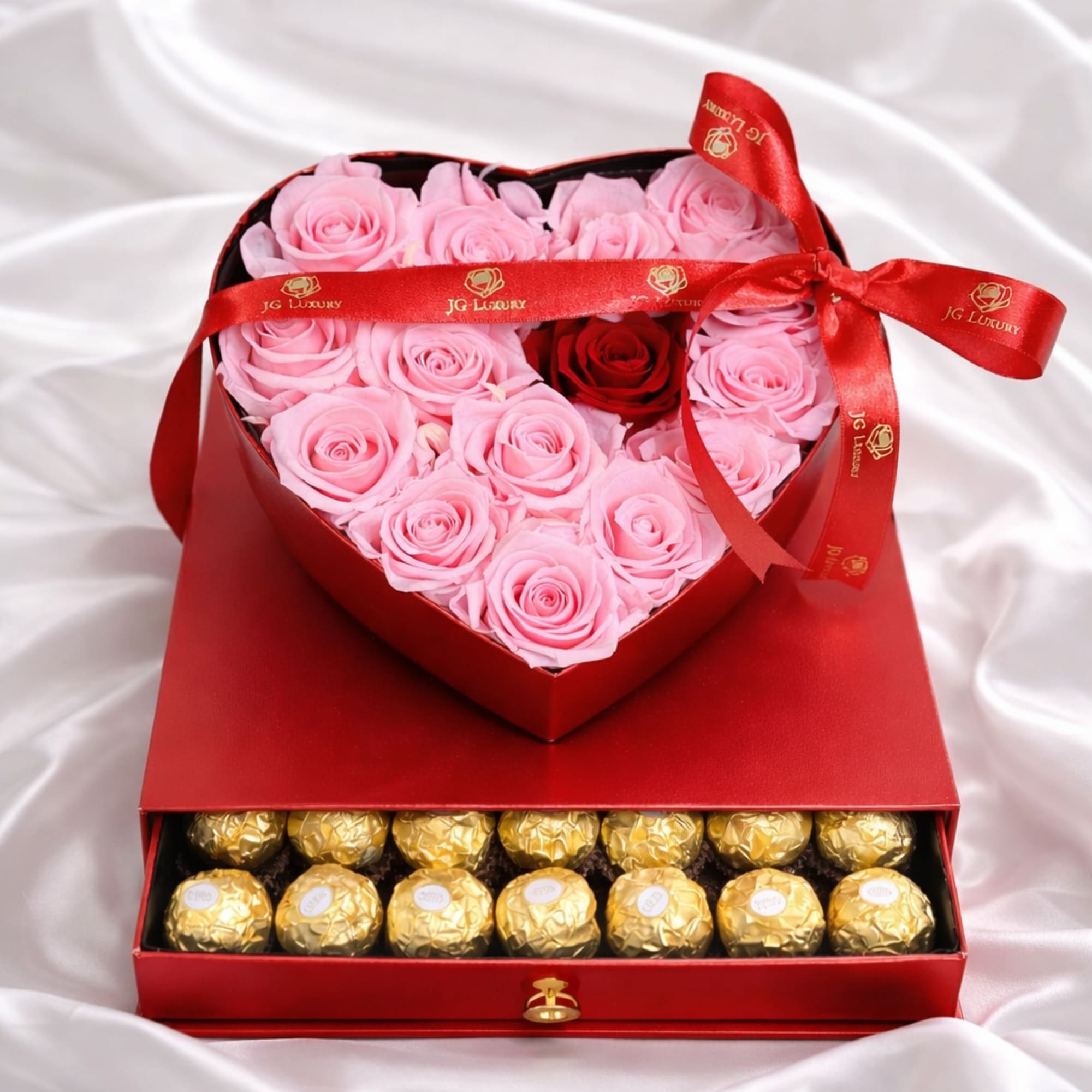 Red heart shaped box filled with soft pink natural roses and a