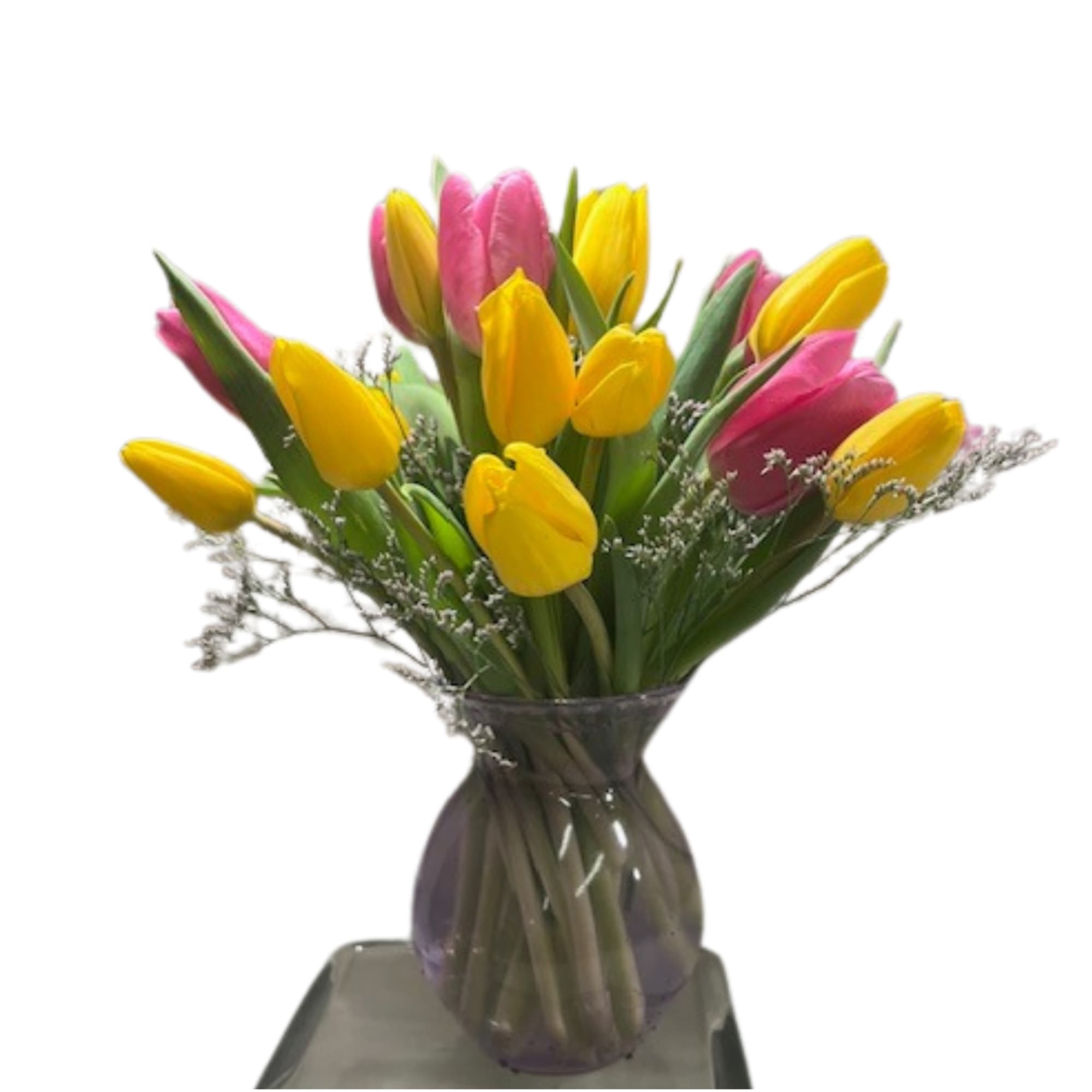 24 Red tulips arranged beautifully in colored glass vase with caspia