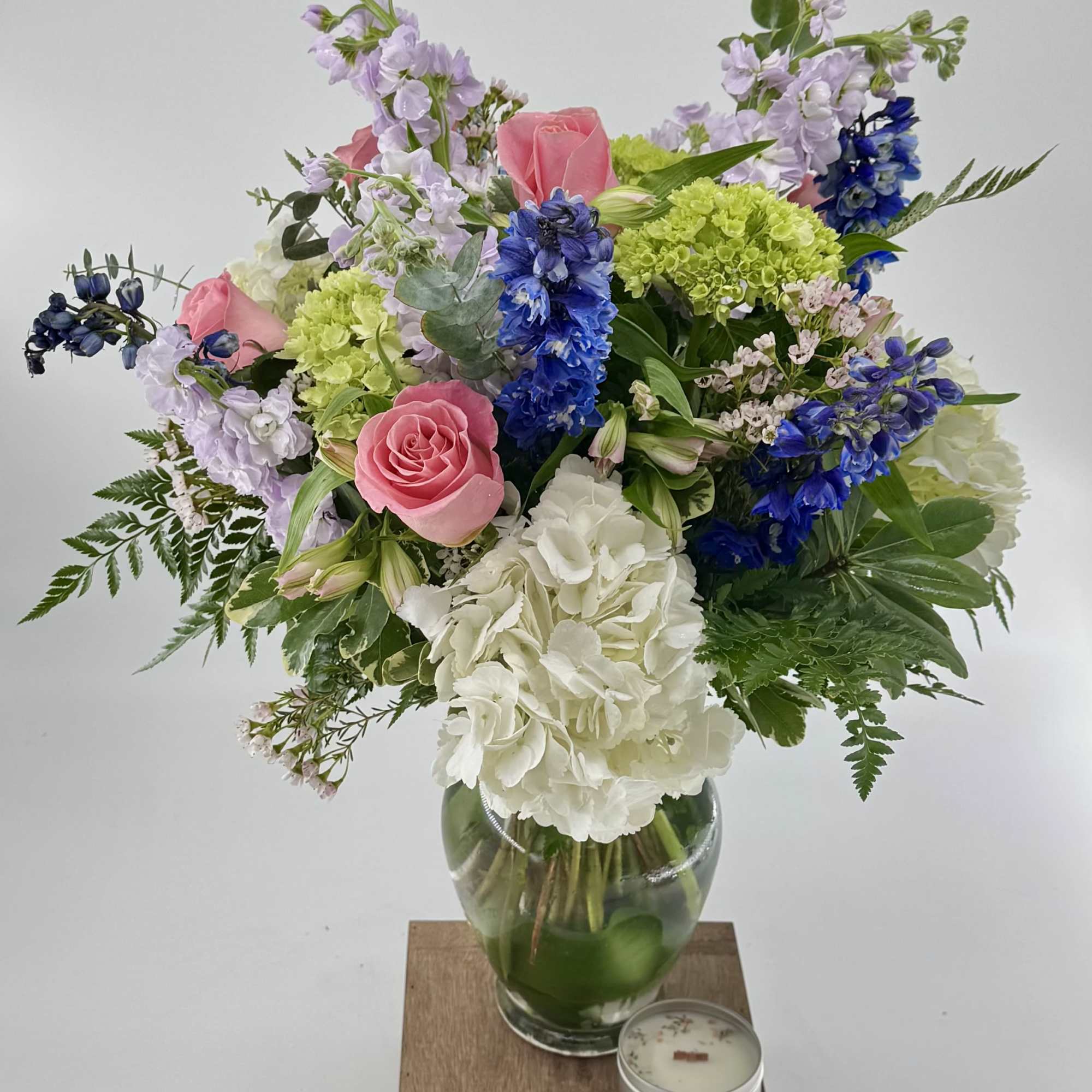 Step into a whimsical realm with our "Tranquil Oasis" floral arrangement, a