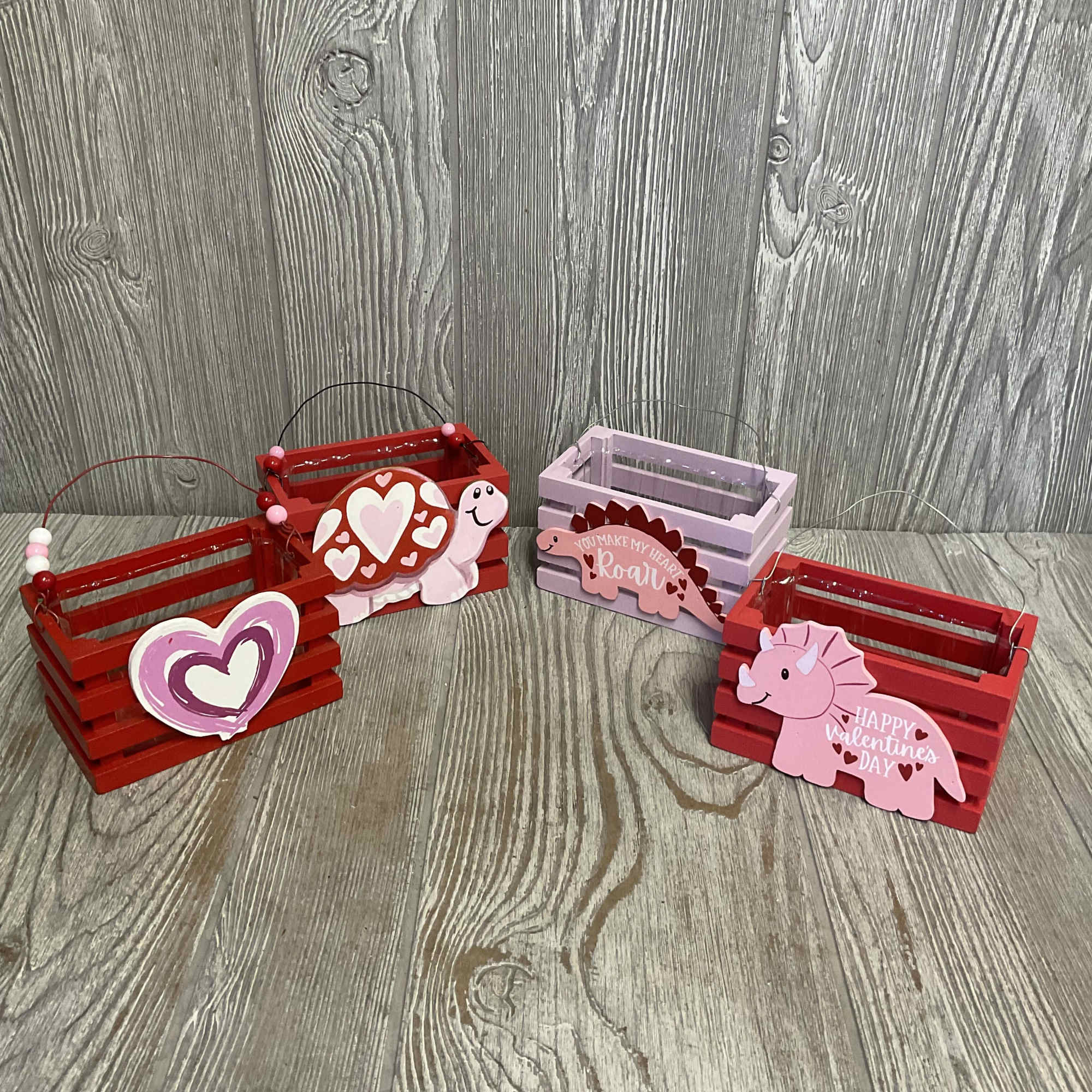 Two mini Kalanchoes in wooden valentines planter. Planter designs and Kalanchoe colors