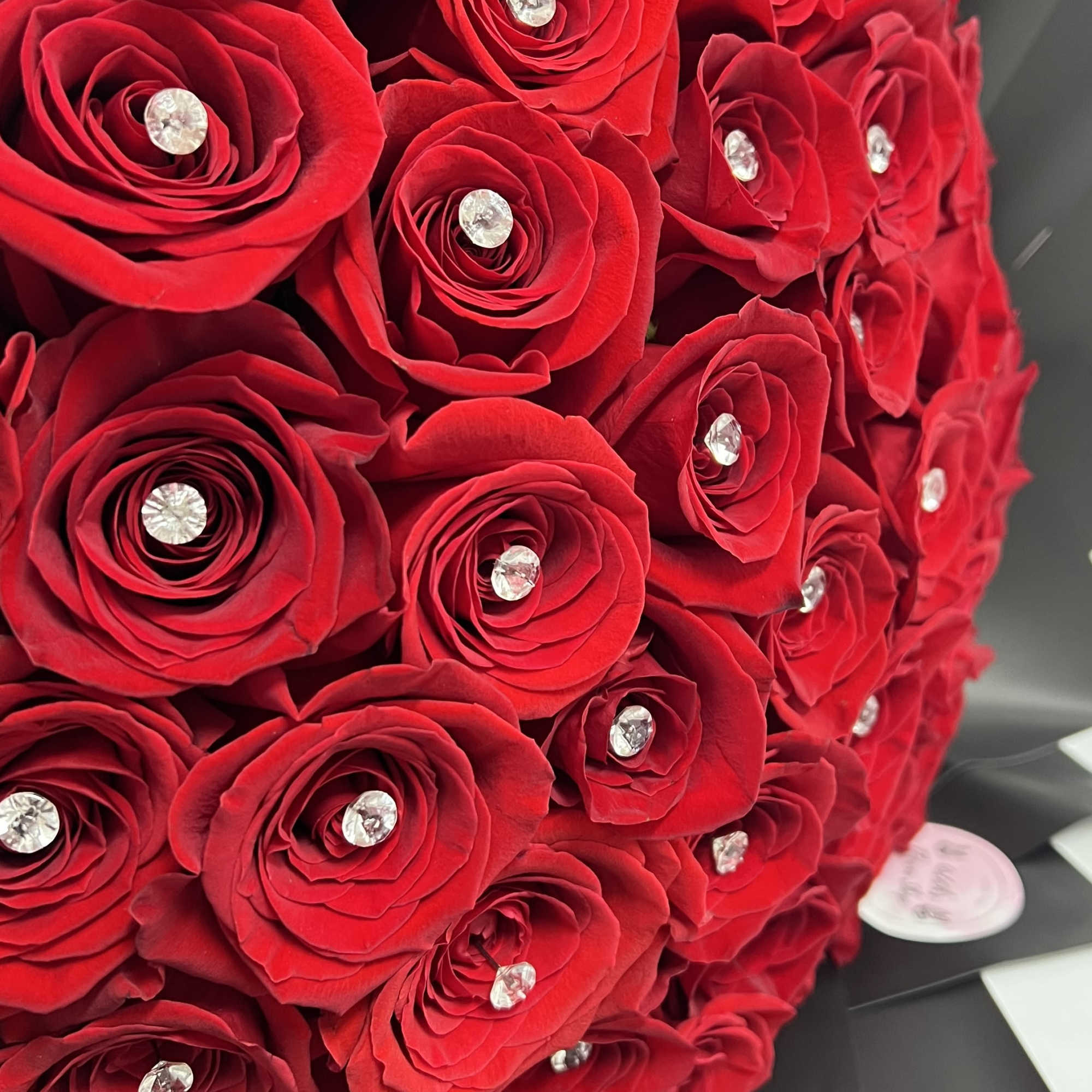 Buyer will receive 50 Red Roses With Pins And Black Wrapping Paper