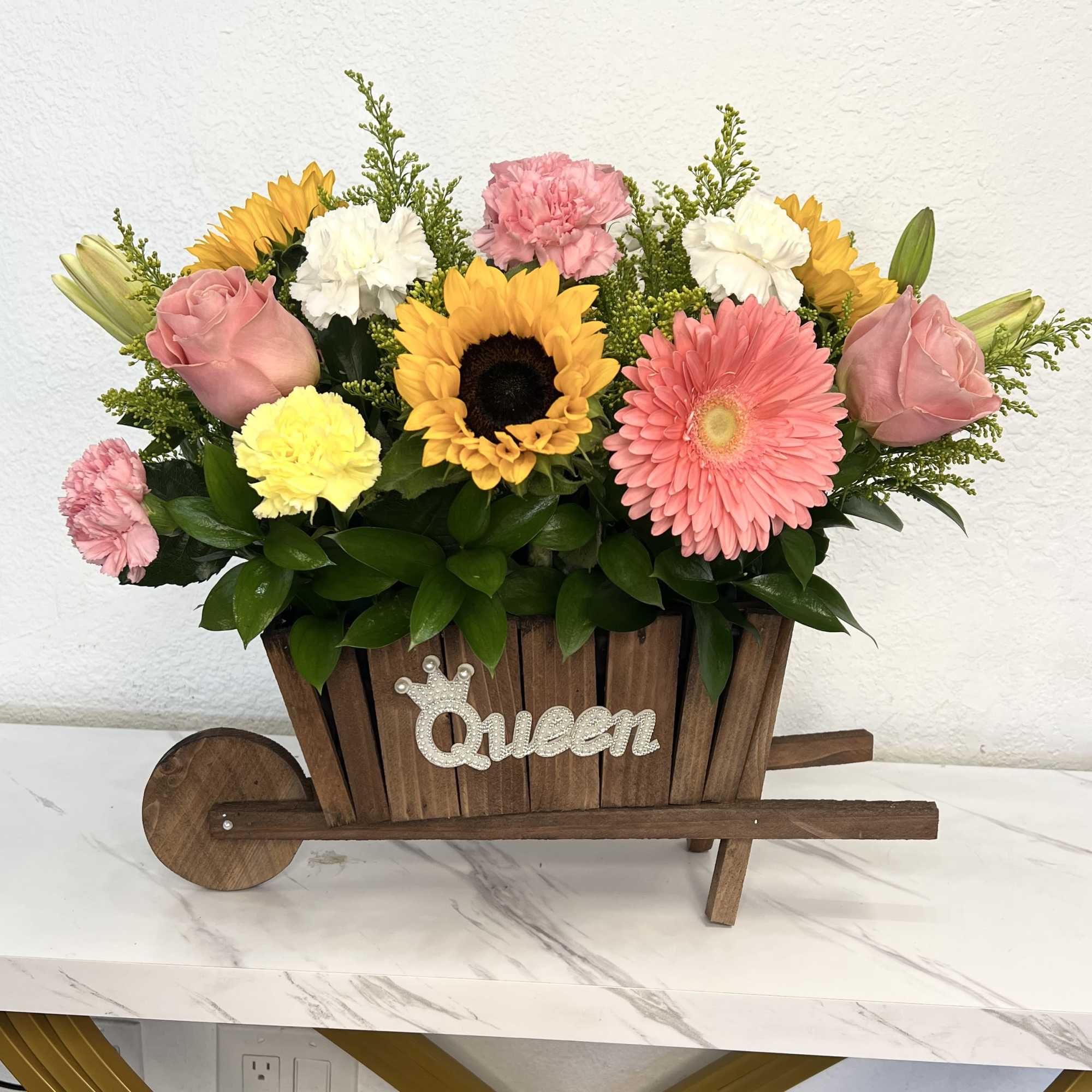 Buyer will receive a Carretita with mix flowers