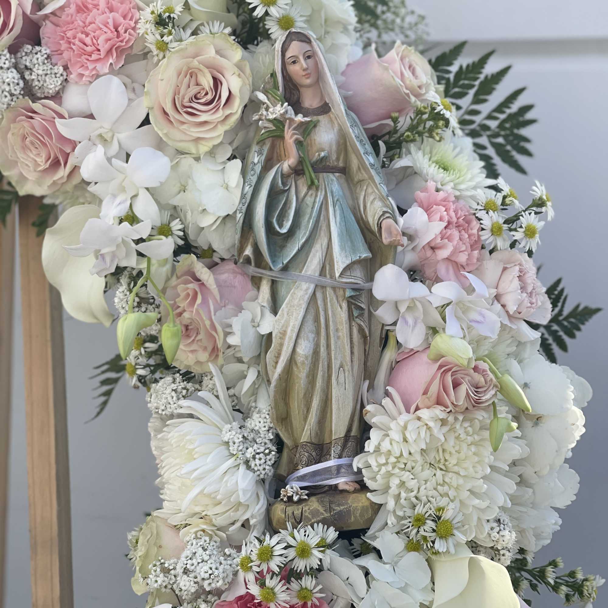 Virgin Mary statue made out of wood in 35&rdquo; wreath 