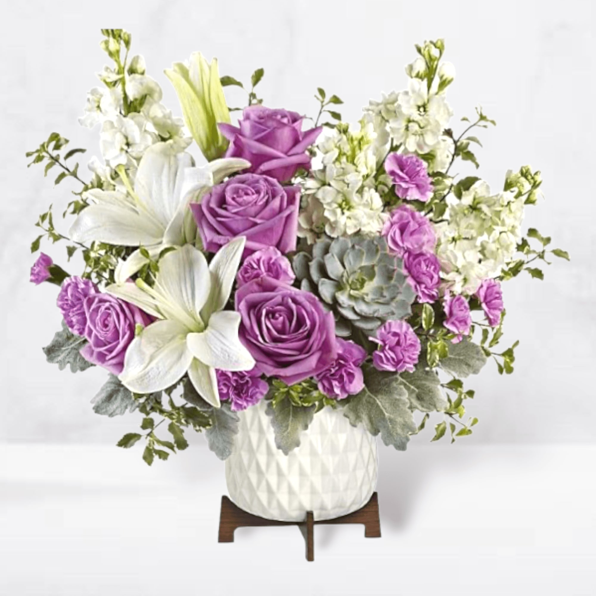 This super chic, mid-mod masterpiece pairs a luxe living succulent with lush