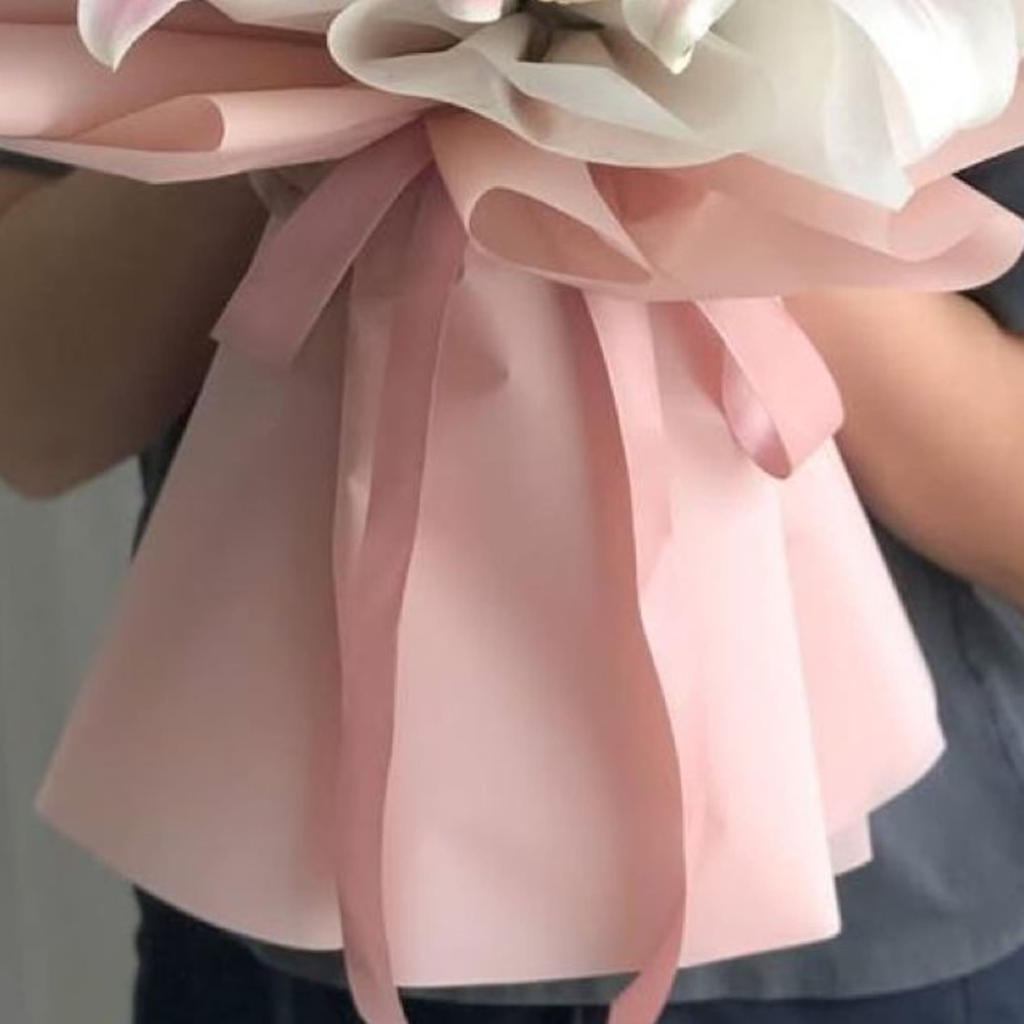 Bouquet pink and white 24 stems of roses .