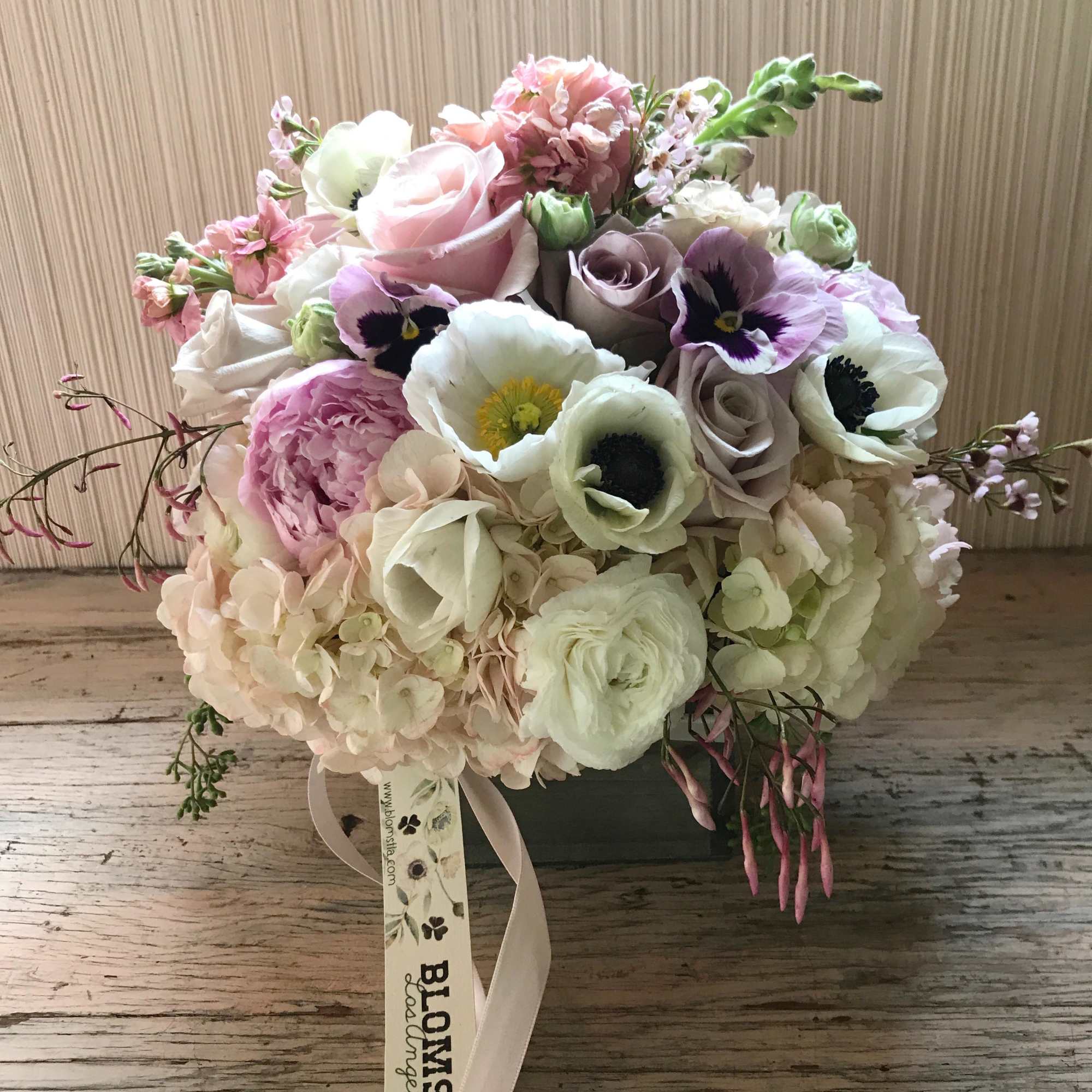 Gorgeous wooden box packed with pastel colored flowers. For the hippie, the