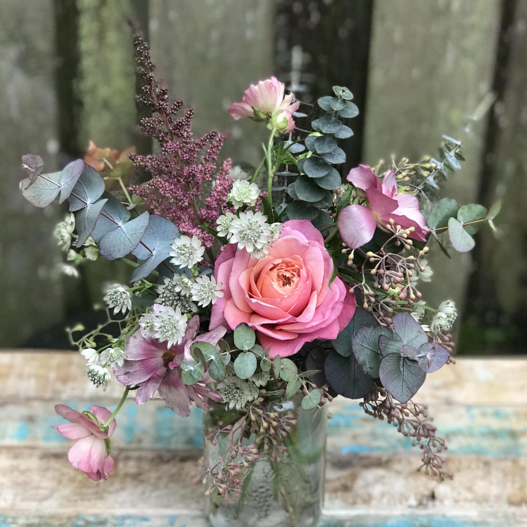 Spring colors and soft greens in a loose garden style, gathered in