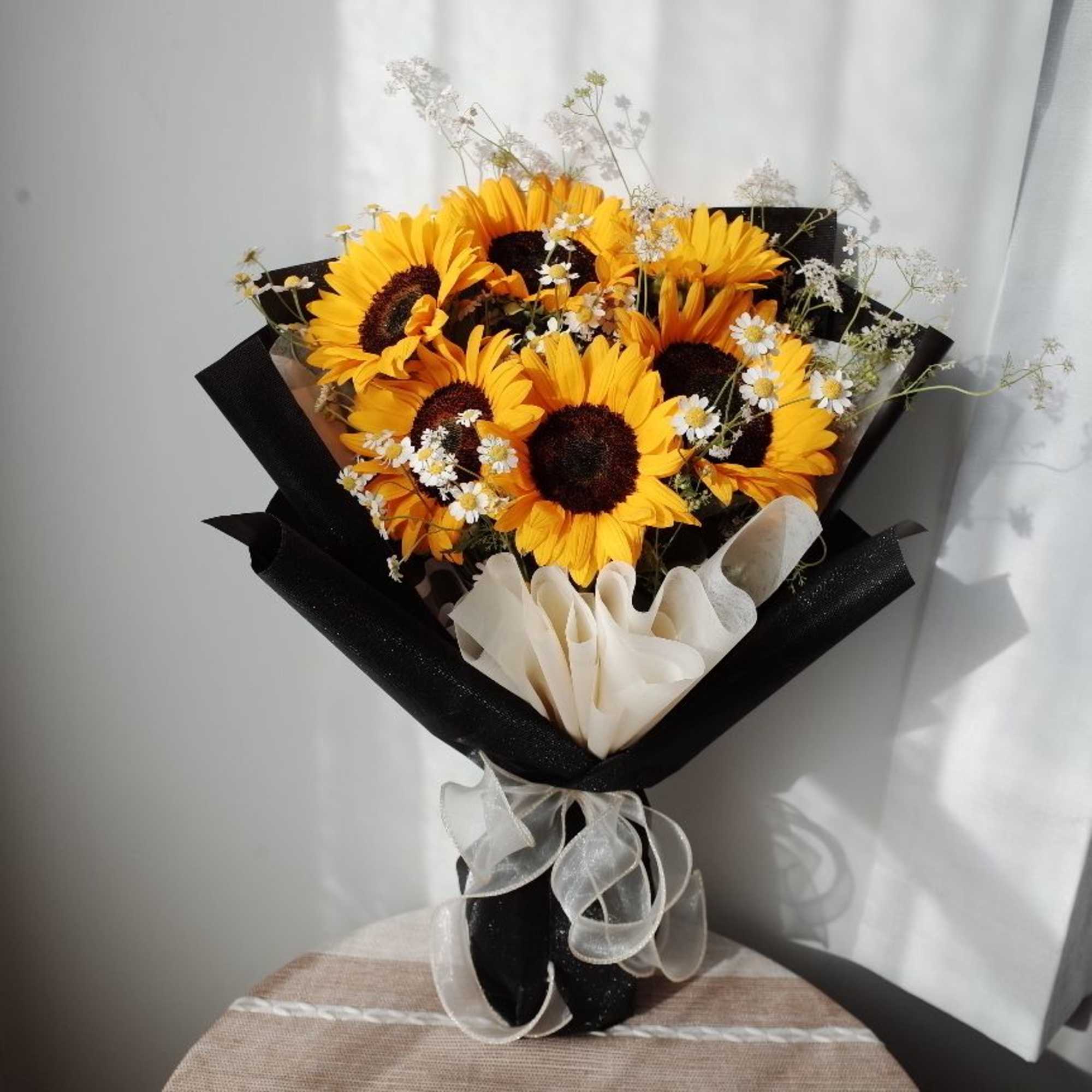 Celebrate the climb and the view.  
Vibrant sunflowers bloom like medals