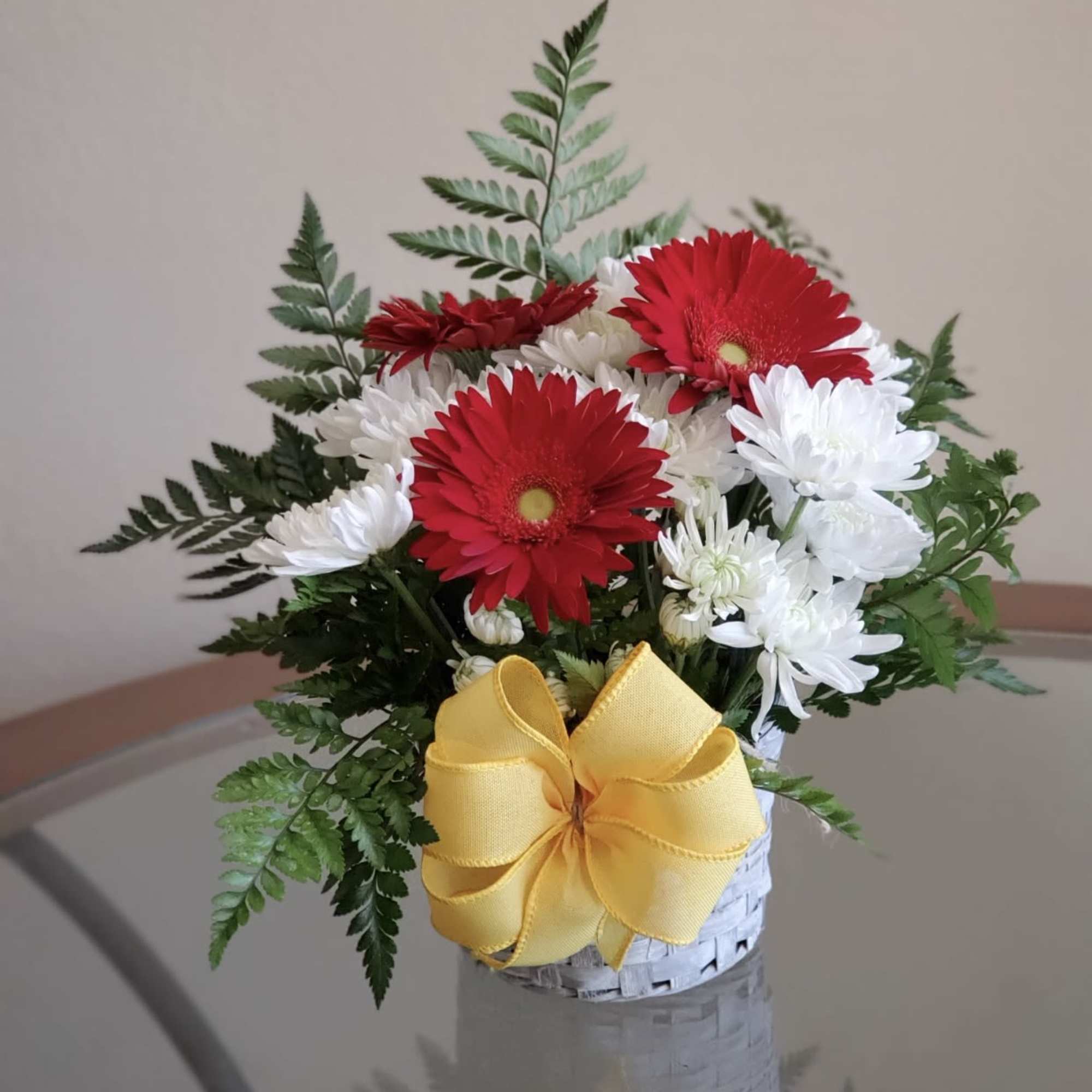 Send your festive congratulations along with this bright, cheery bowl of roses