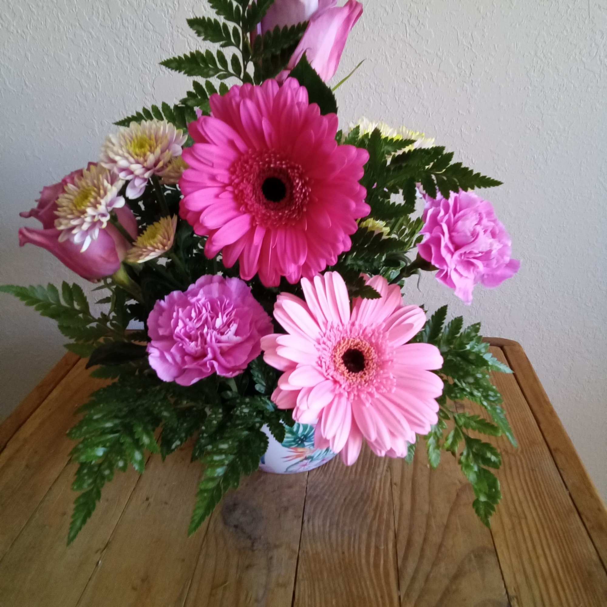 Send your festive congratulations along with this bright, cheery bowl of roses