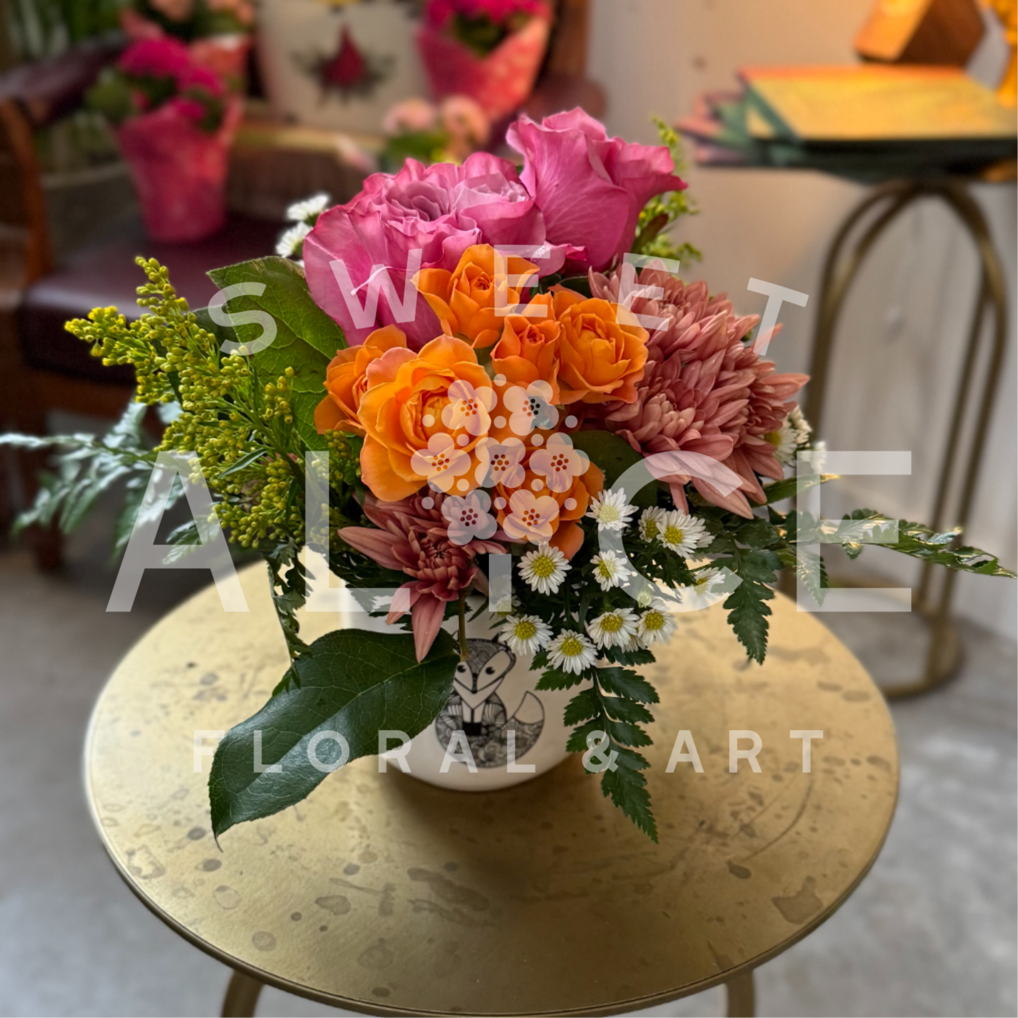 A lovely little arrangement starring everyones' favorite flower, the rose. 

Please note