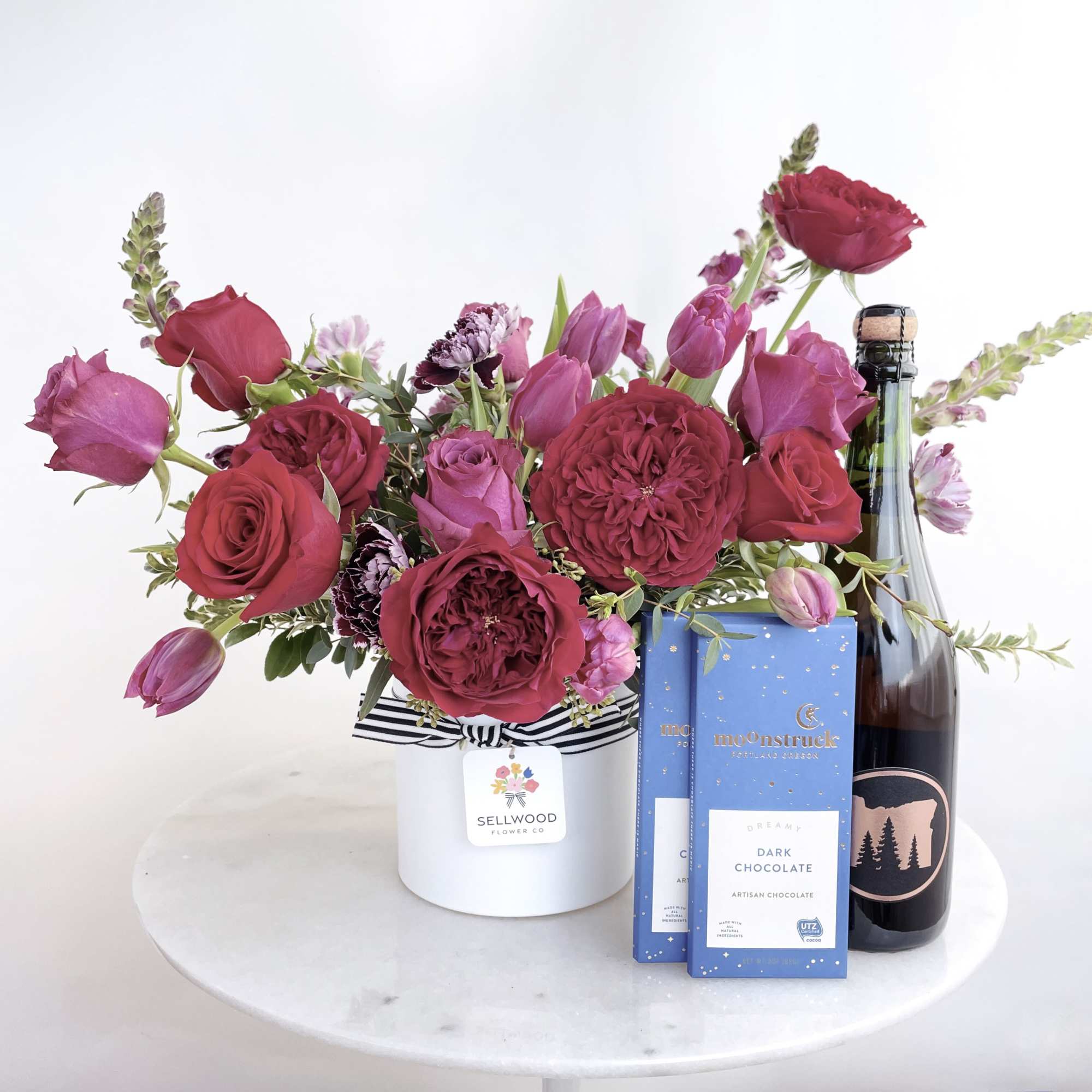 Add some decadent chocolate and bubbly to the lovely Gem arrangement! This