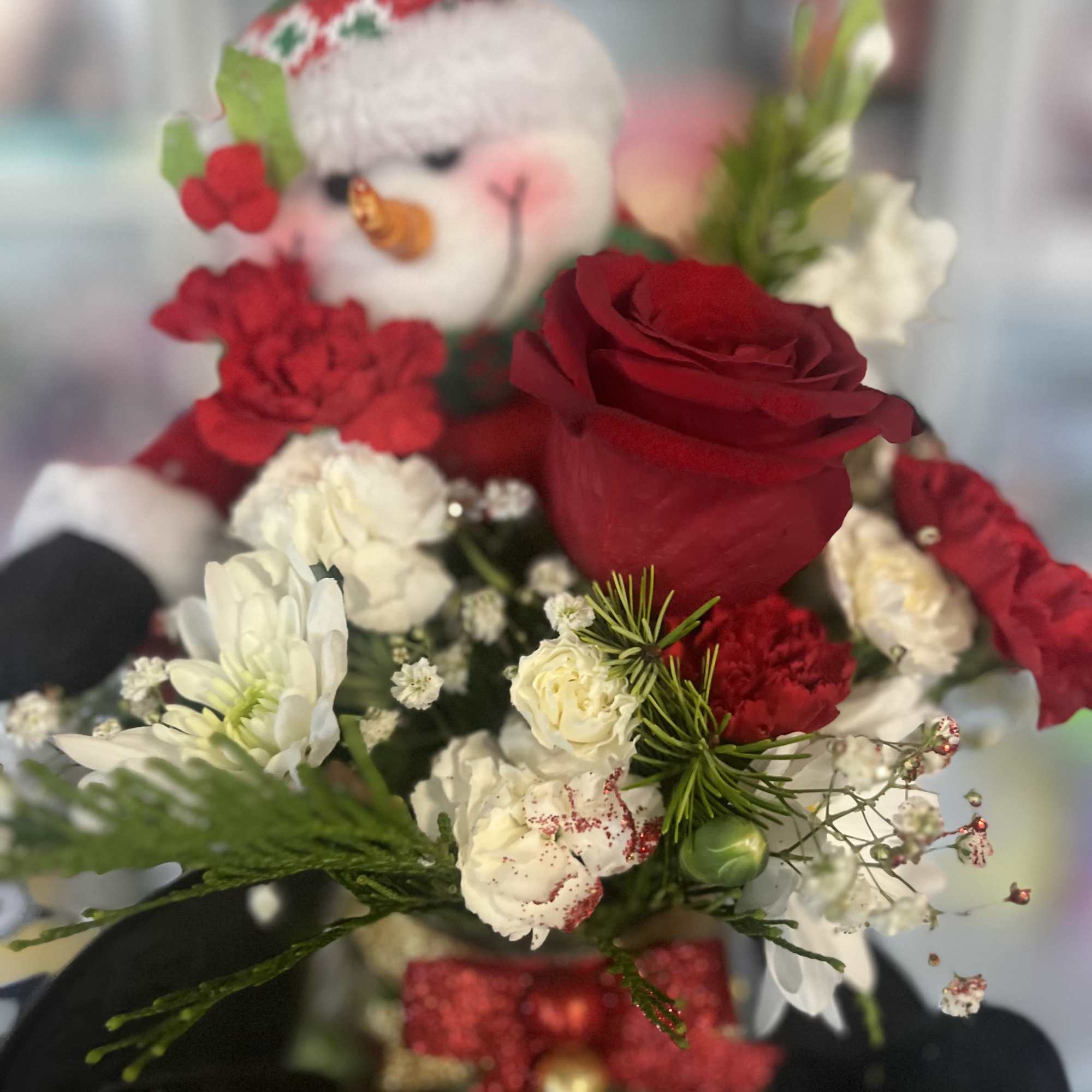 fresh floral in snow man container 