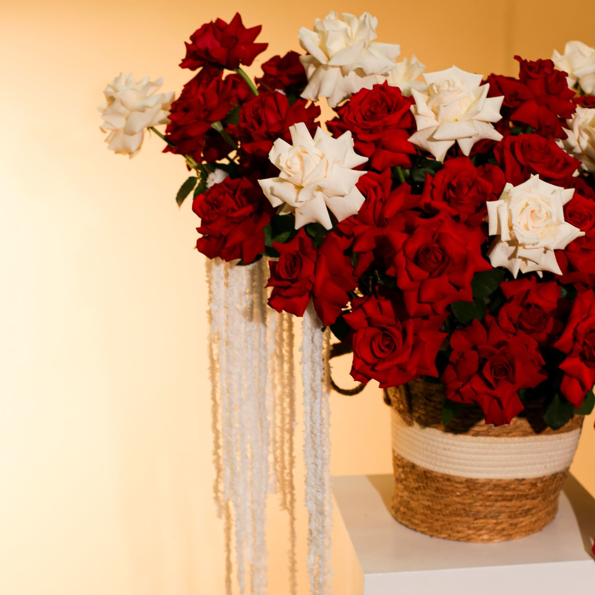 Luxury red and white rose basket arrangement crafted with premium fresh roses