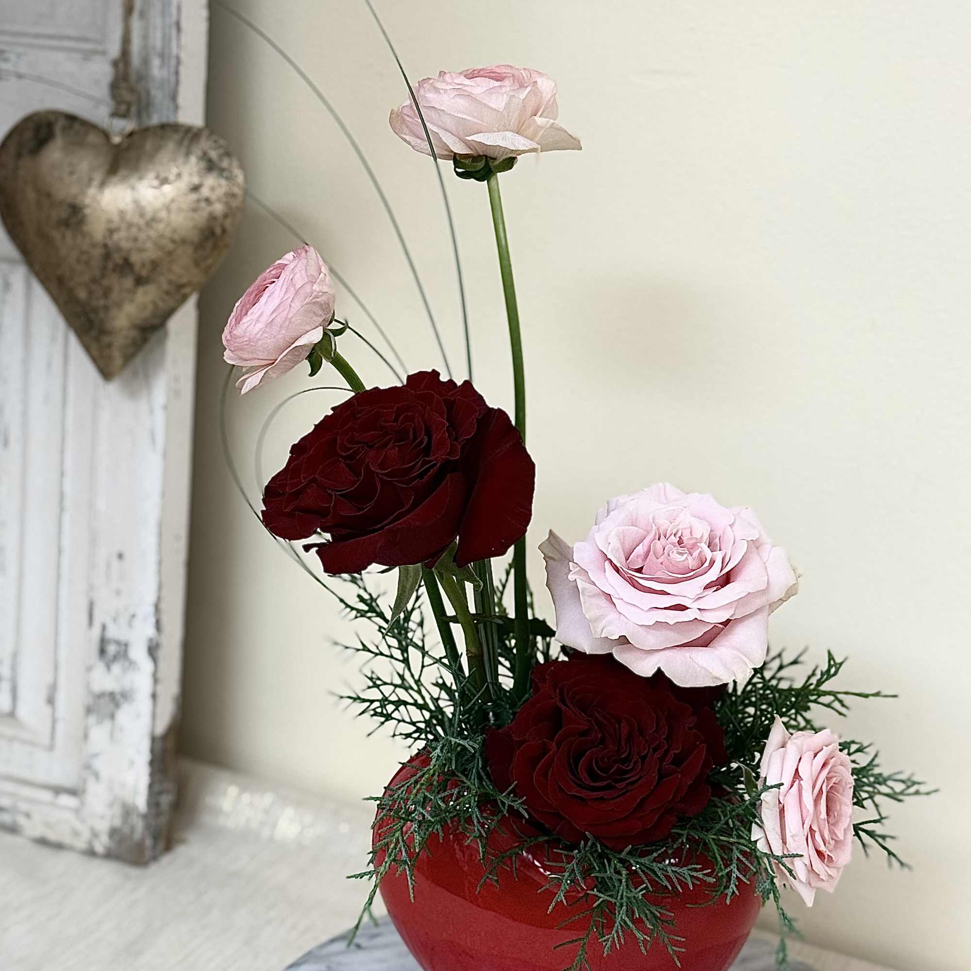A modern design in a beautiful red heart vase to express your