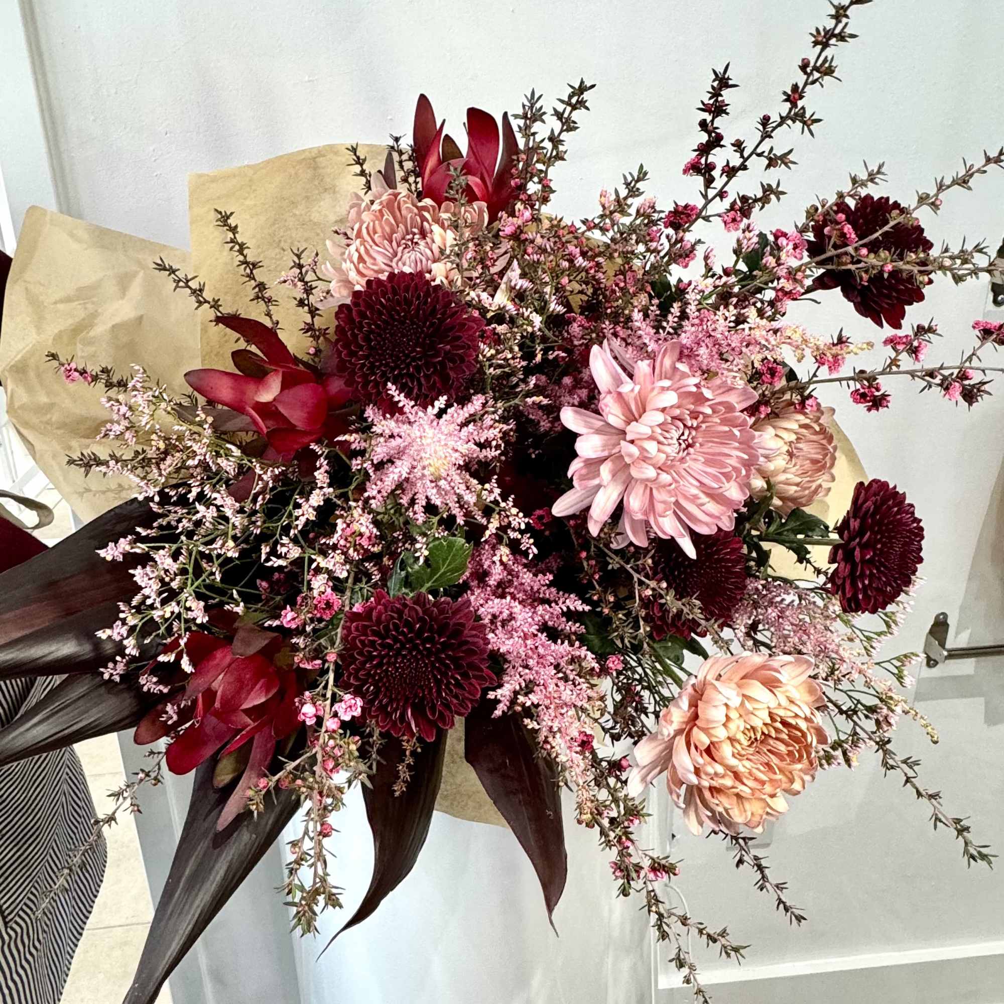 This colosal tied bouquet is a modern mixture of pinks and magentas