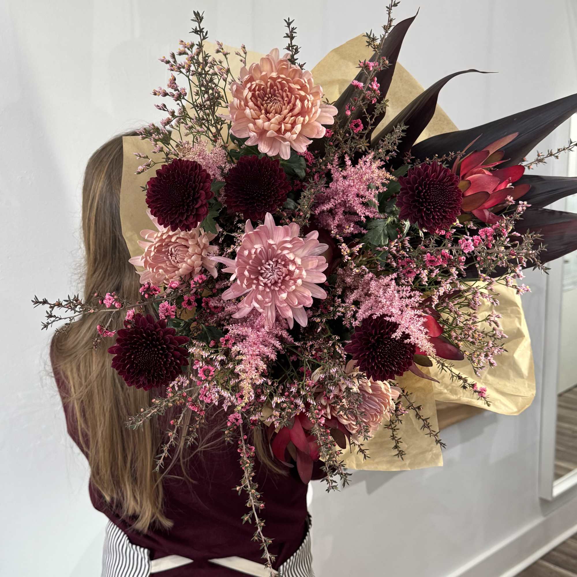 This colosal tied bouquet is a modern mixture of pinks and magentas