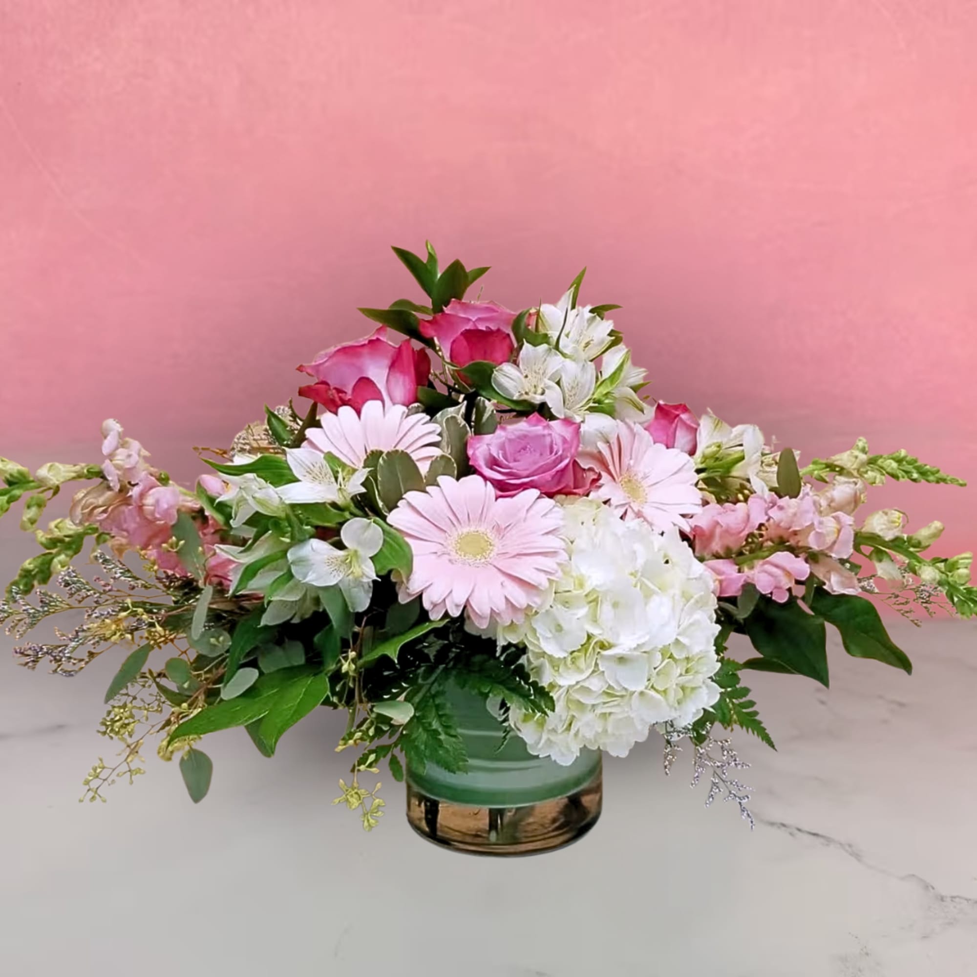 "Modern Elegance" is a stunning floral arrangement that combines classic charm with