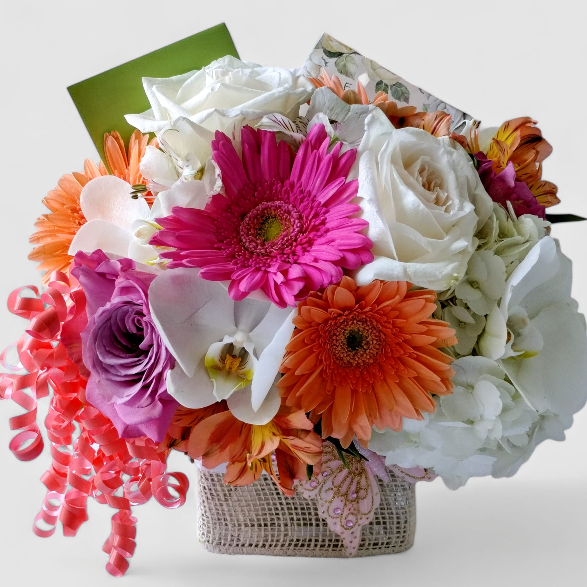 Lovely roses orchids and so much more arranged in a modern glass