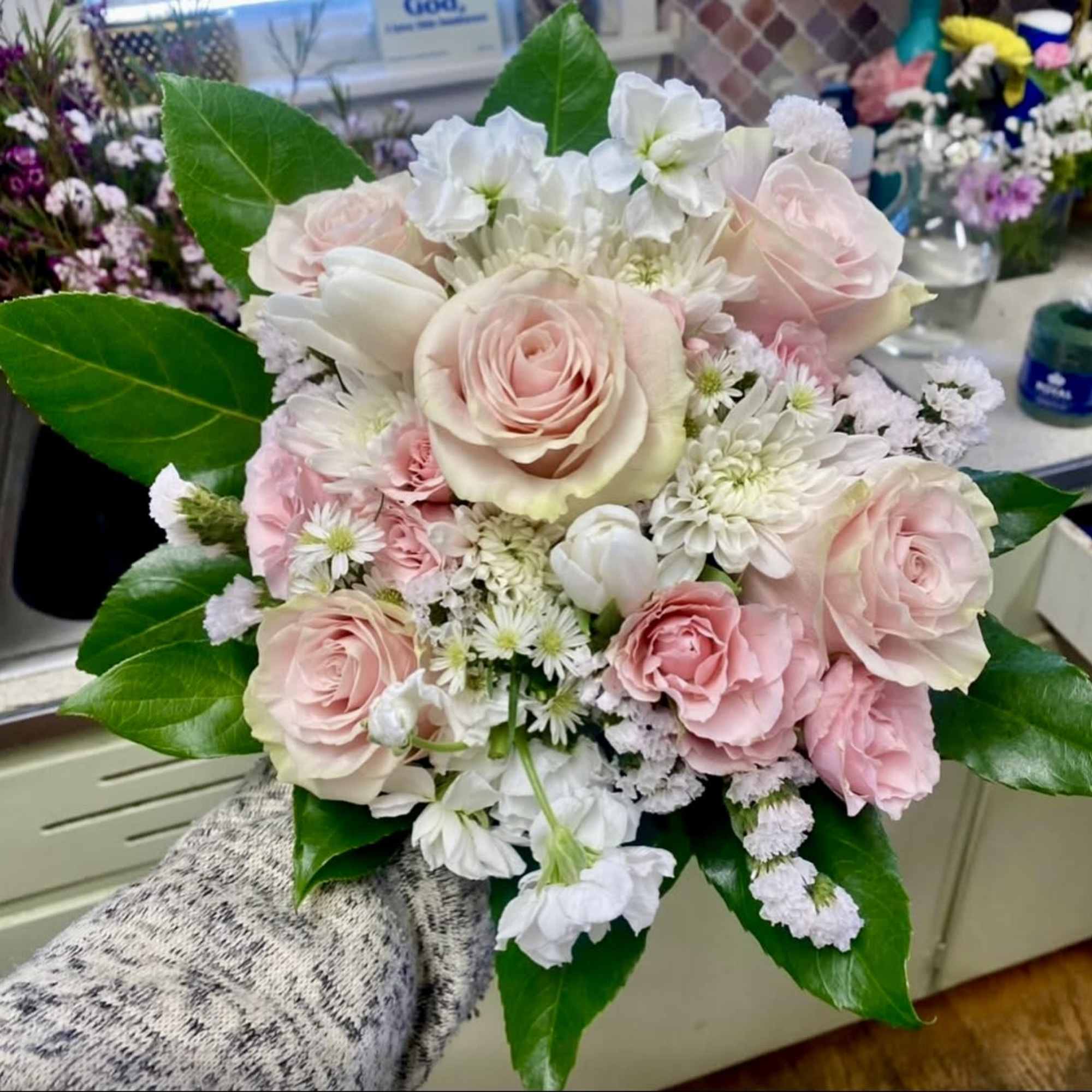 Perfect pink roses matched perfectly with a coordinated bow, filler flowers and