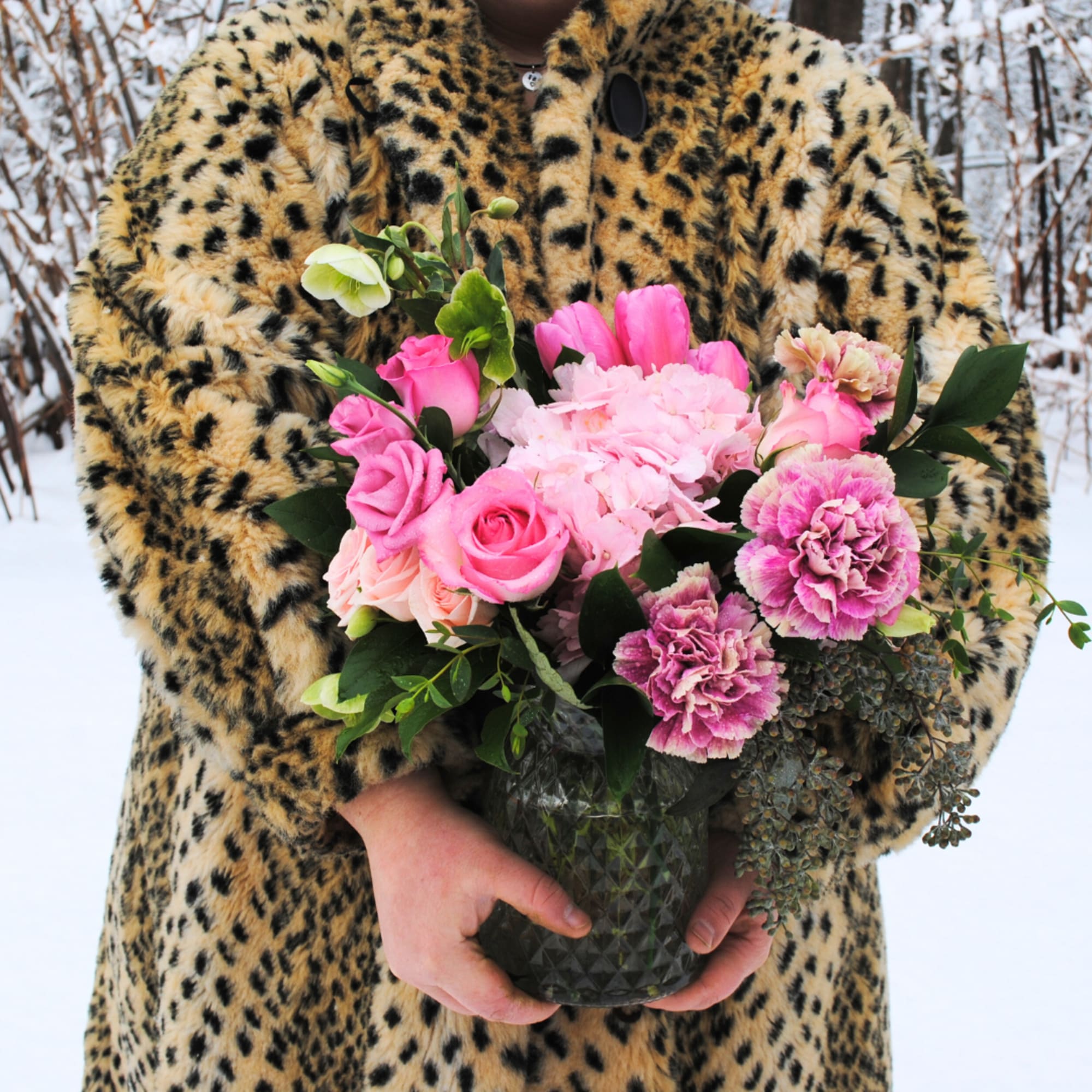 A primarily pink toned arrangement in a glass vase! 

Deluxe and premium