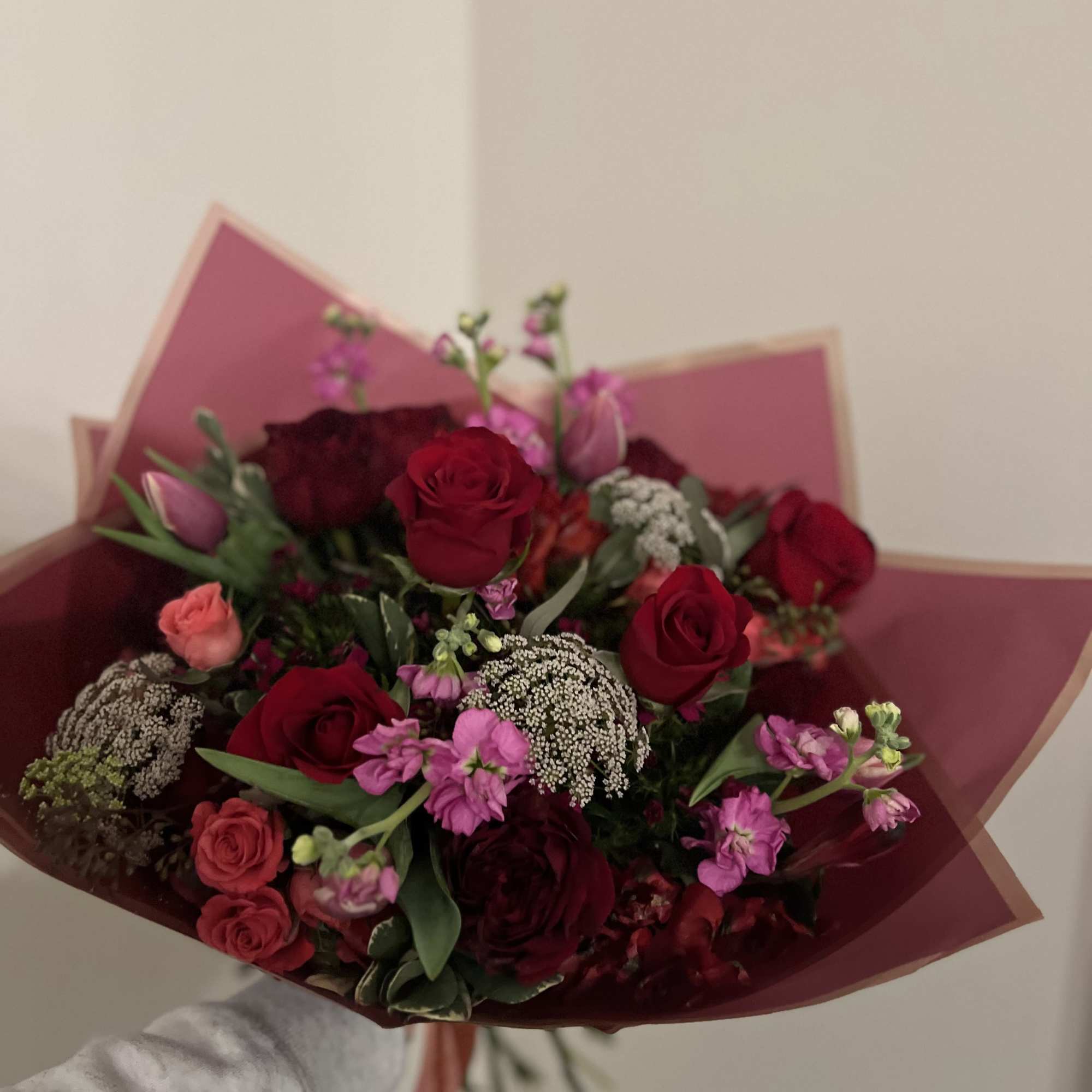 A Large Lush Wrapped Bouquet of Seasonal Favorites in a red and