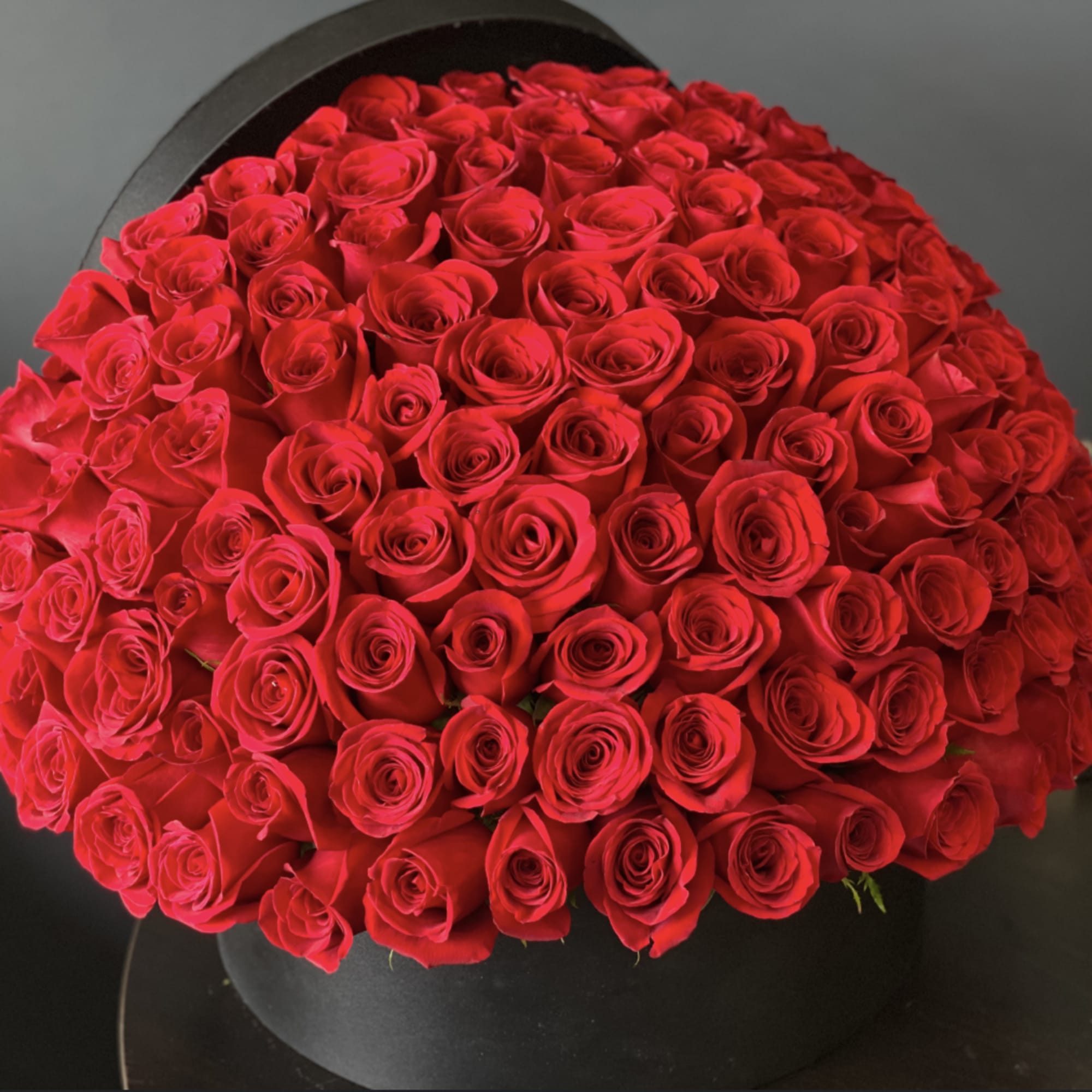 Premium red roses in a box arrangement.
