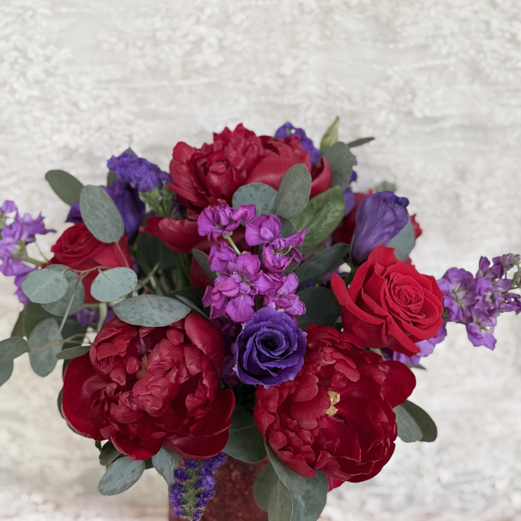 Peonies, roses, lisianthus, stock, statice and eucalyptus 