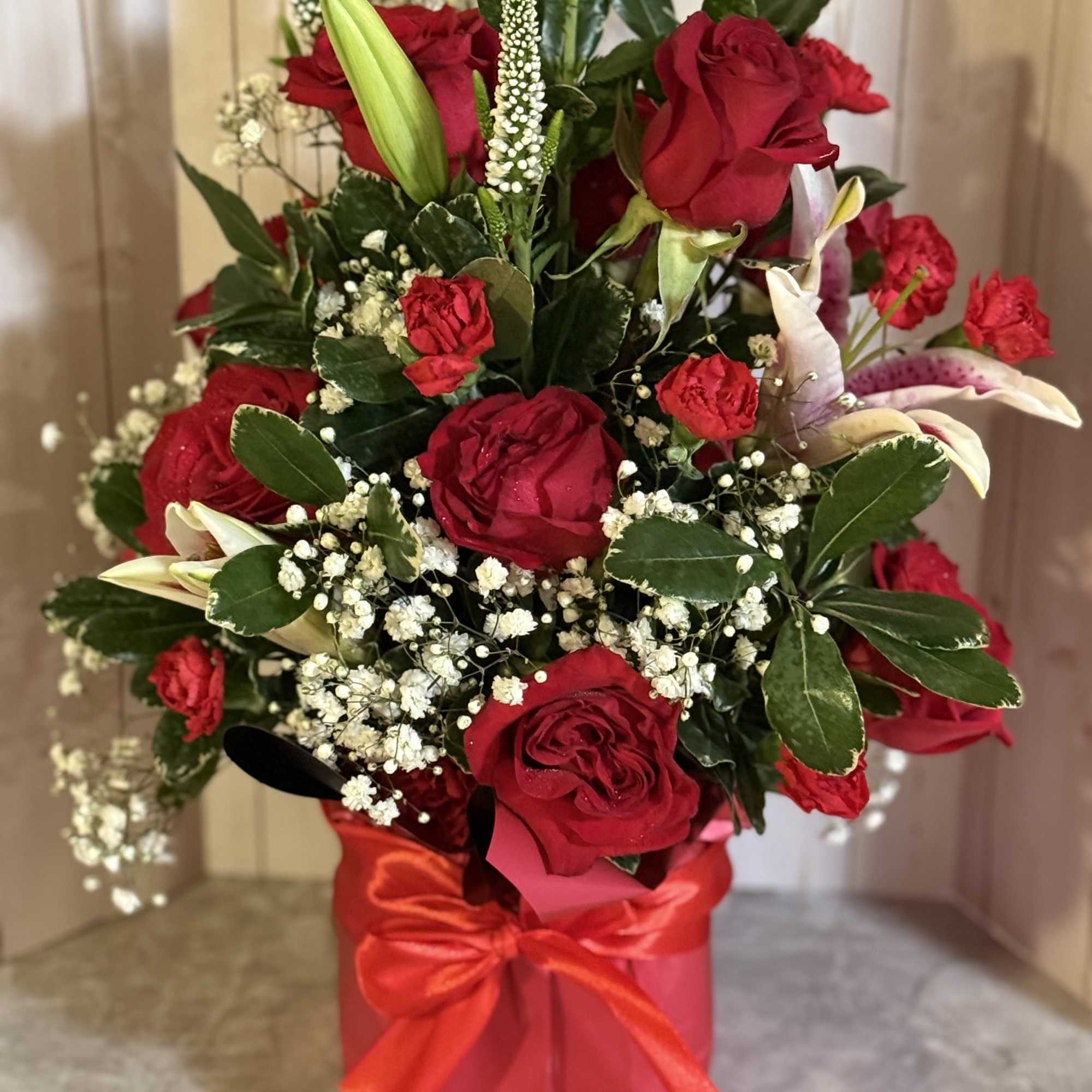 Square vase wrapped in luxurious red paper