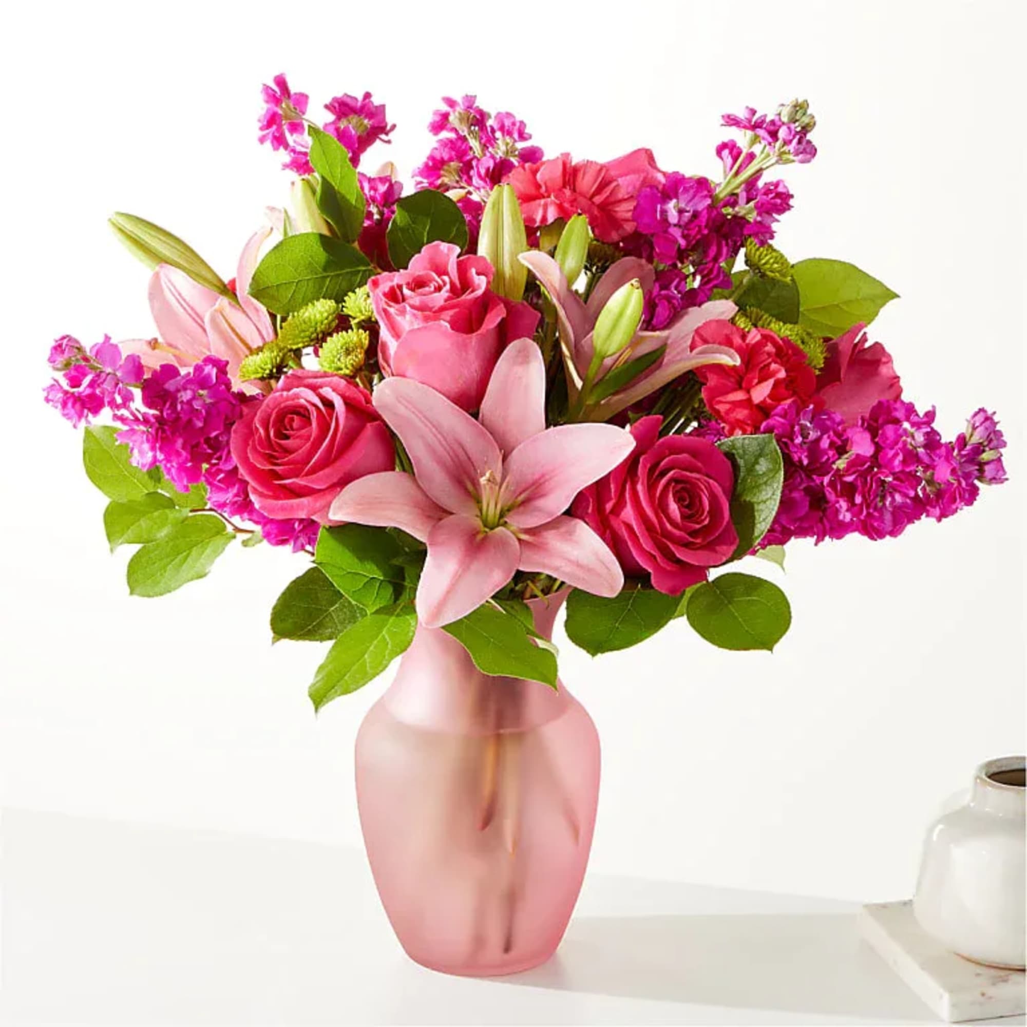 This refreshing bouquet is full of berry colored signature stems making it