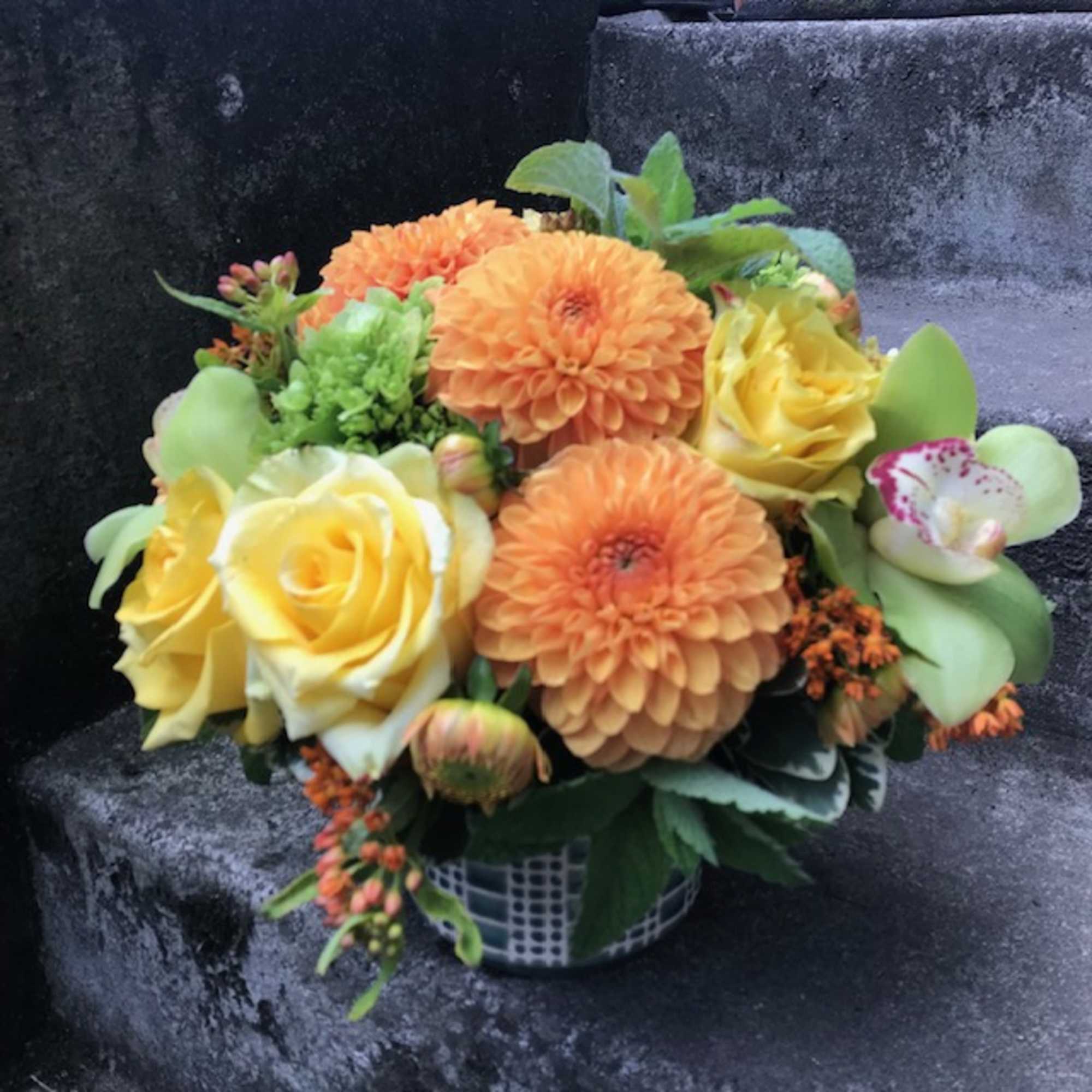 A medium-size floral arrangement that will not overwhelm a desk or coffee