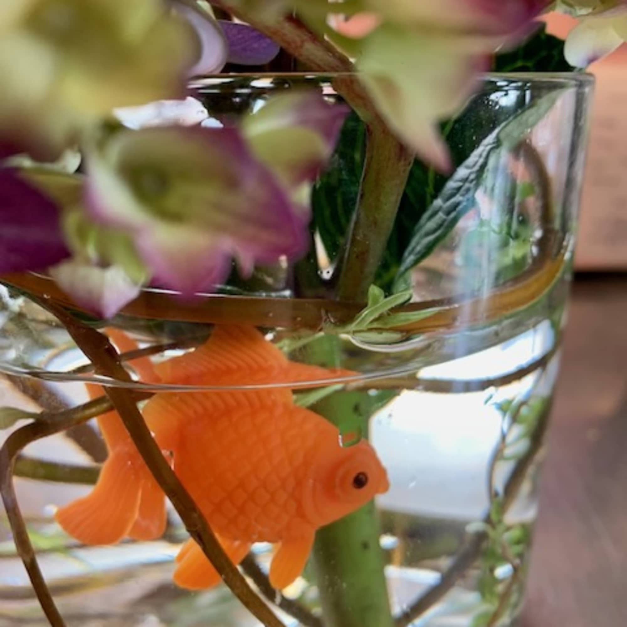 Cute FAUX goldfish swims at the bottom of this beautiful hydrangea design.