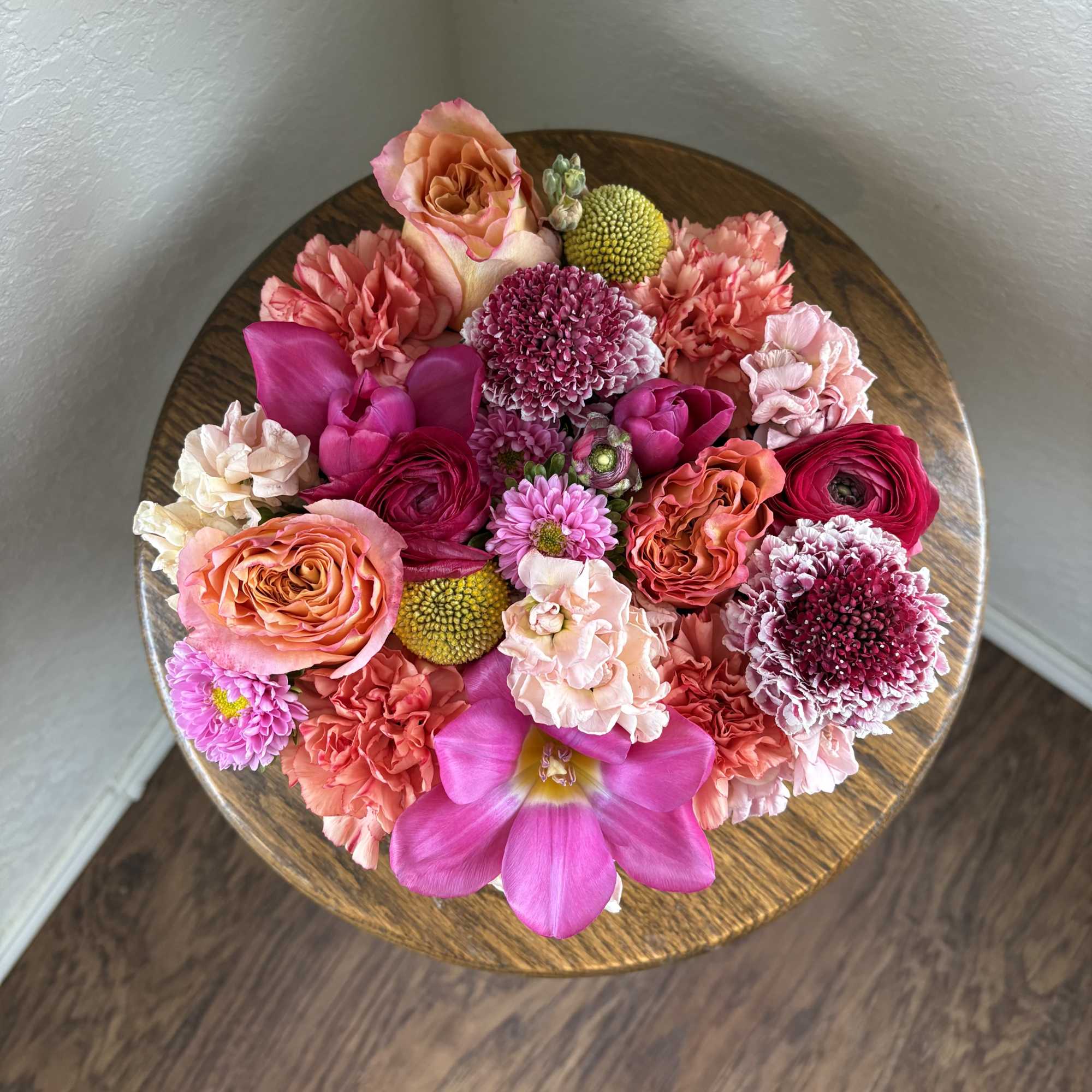 A cheerful compact arrangement brimming with sunlit yellows, playful pinks, and soft