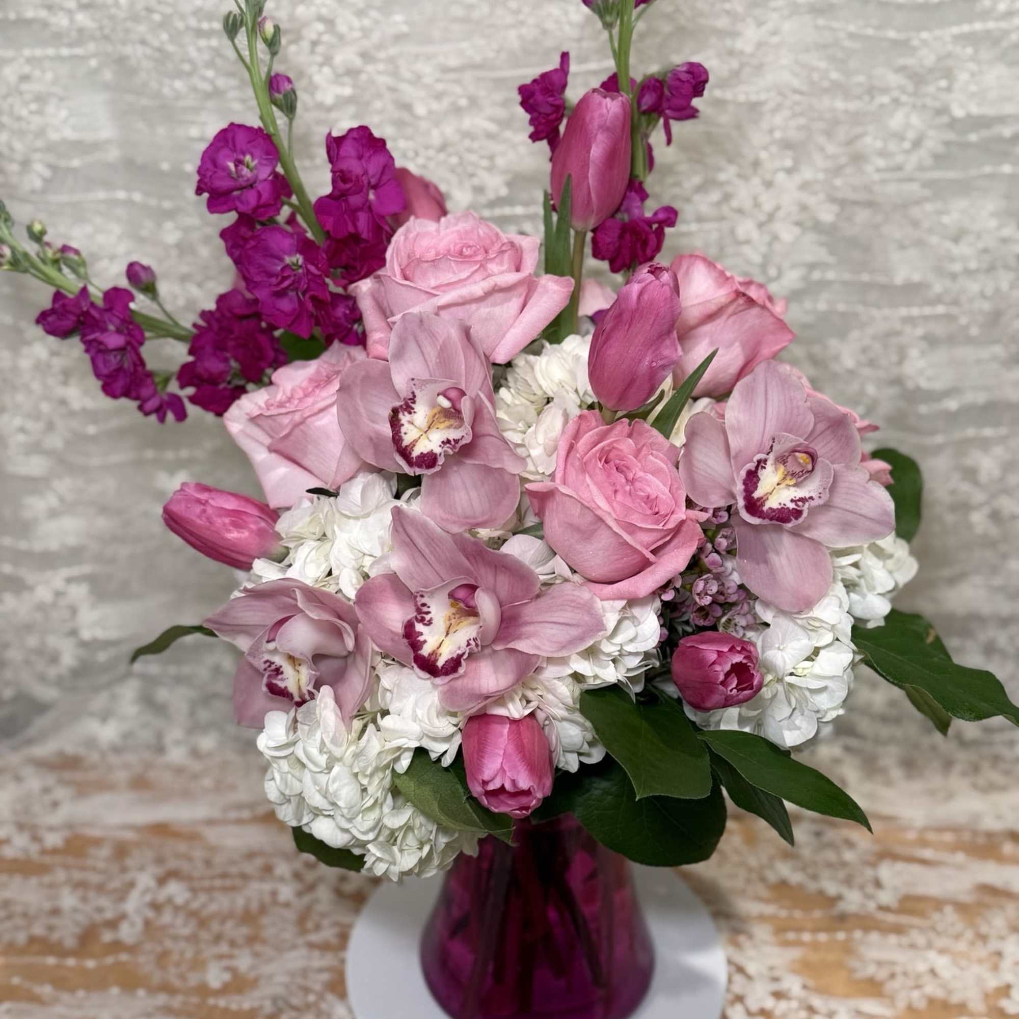 orchids, Roses, Tulips, hydrangea, stock and wax flowers.