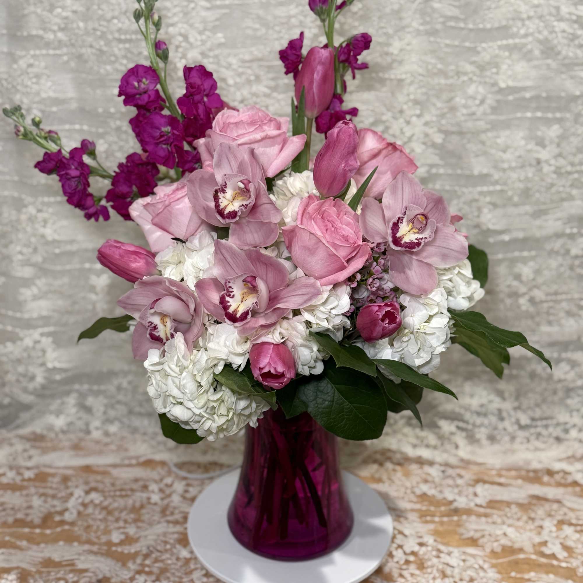 orchids, Roses, Tulips, hydrangea, stock and wax flowers.