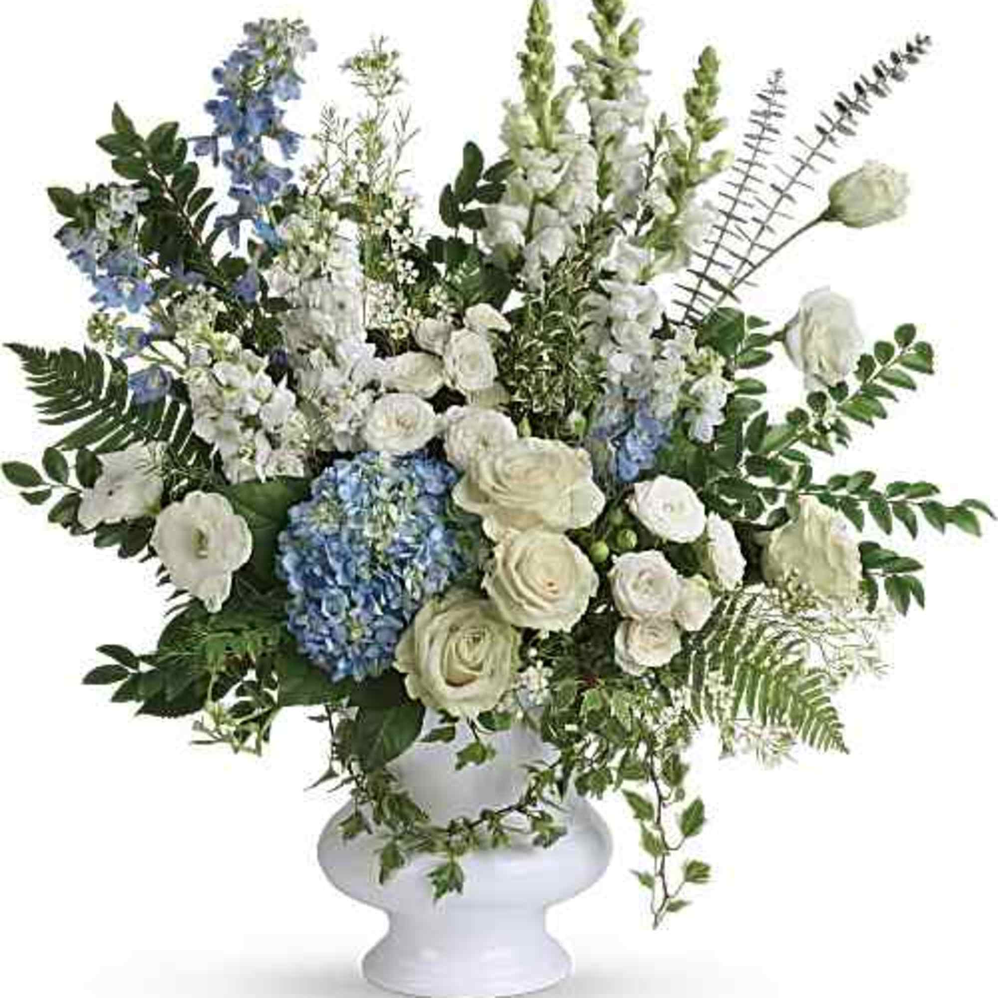 Beautiful arrangement for a sympathy service, with soft colors which are light