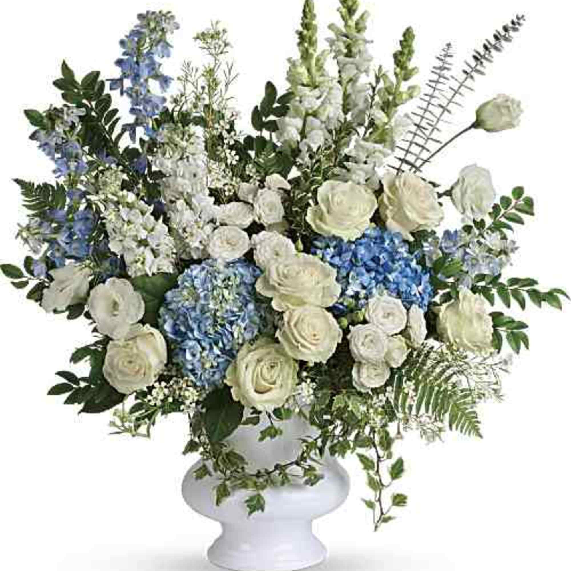 Beautiful arrangement for a sympathy service, with soft colors which are light
