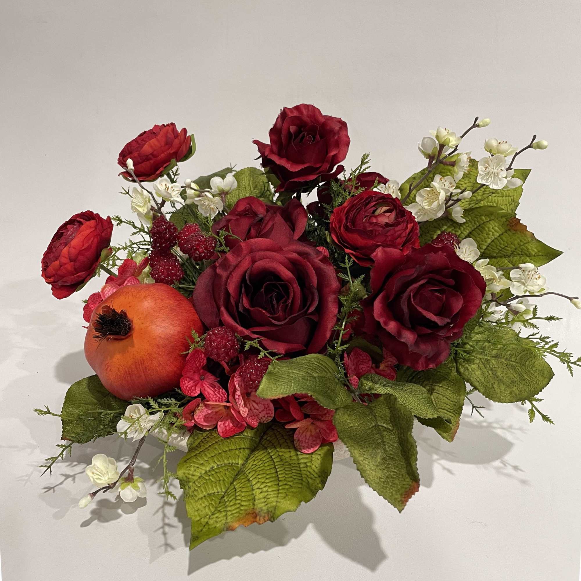 This silk botanical arrangement is designed in a 10" stoneware bowl, making