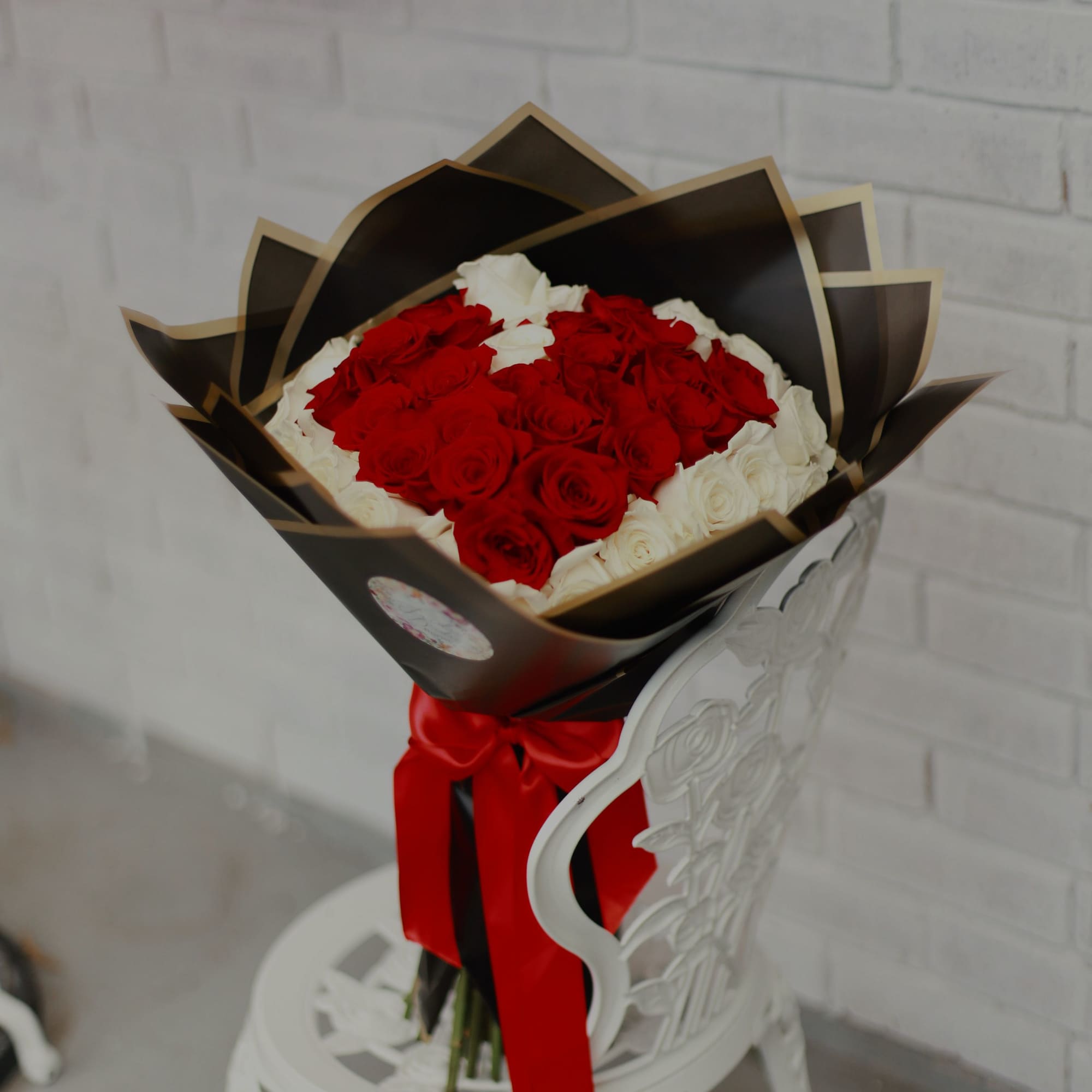 50 beautiful long stem roses with a heart shape in the middle